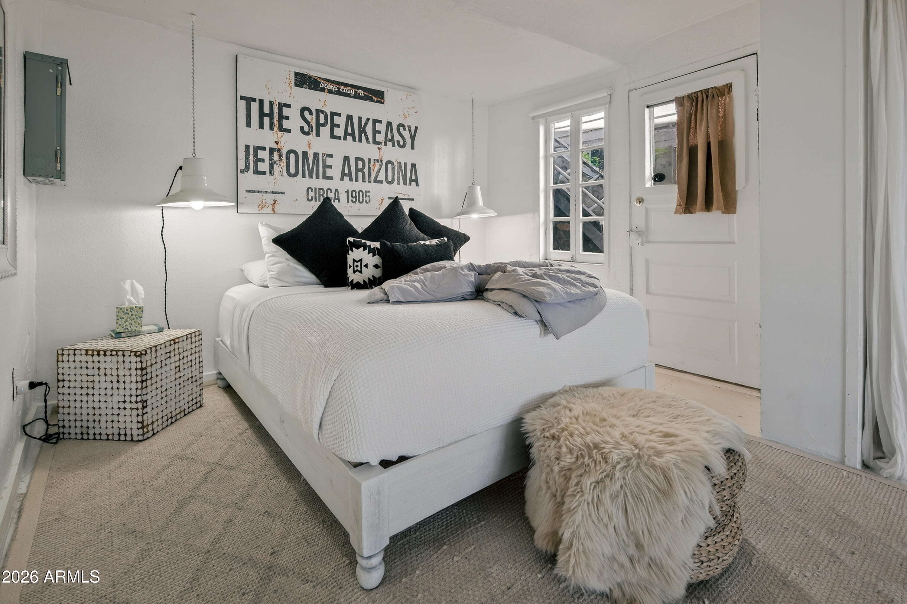 511 Main Street Jerome, AZ 86331 - Photo 17 of 67 a bedroom with a bed and window