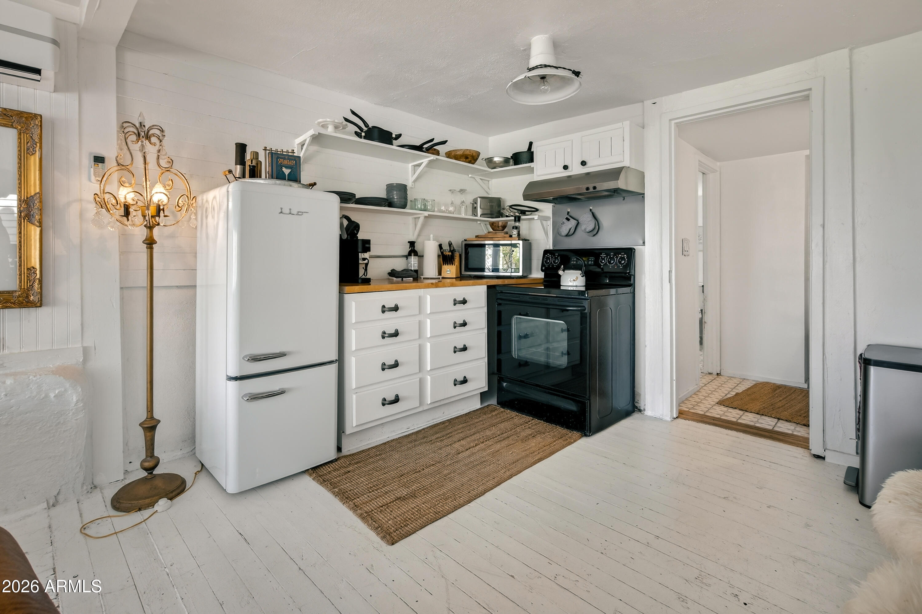 511 Main Street Jerome, AZ 86331 - Photo 18 of 67 a kitchen with stainless steel appliances granite countertop a refrigerator and a stove