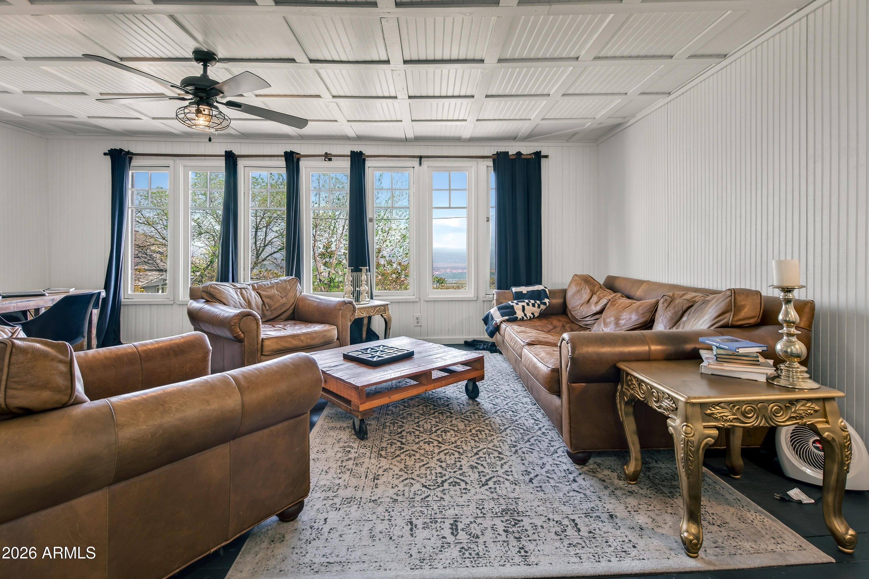 511 Main Street Jerome, AZ 86331 - Photo 32 of 67 a living room with furniture a rug and a chandelier