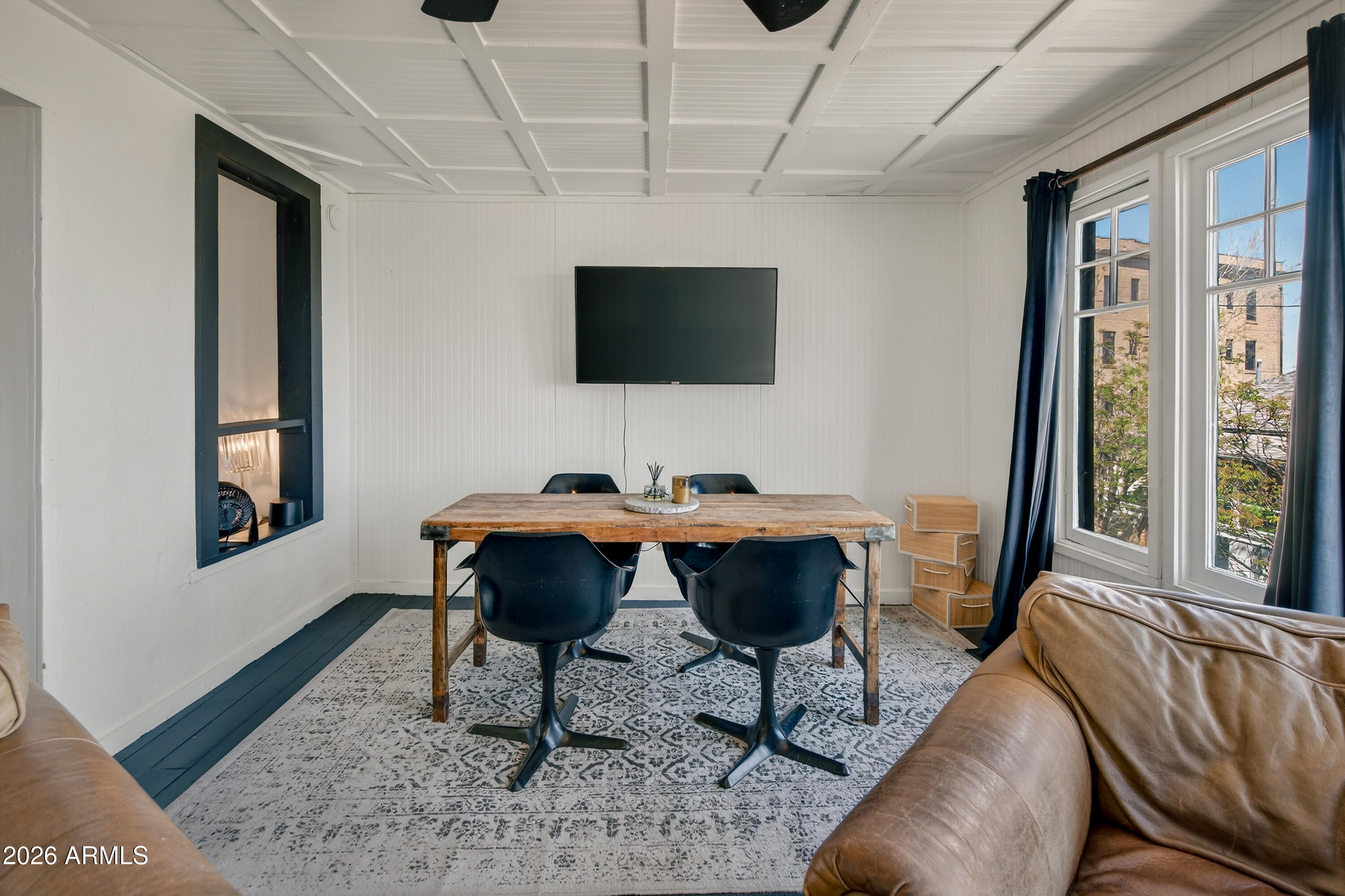 511 Main Street Jerome, AZ 86331 - Photo 33 of 67 a living room with furniture a rug and a large window