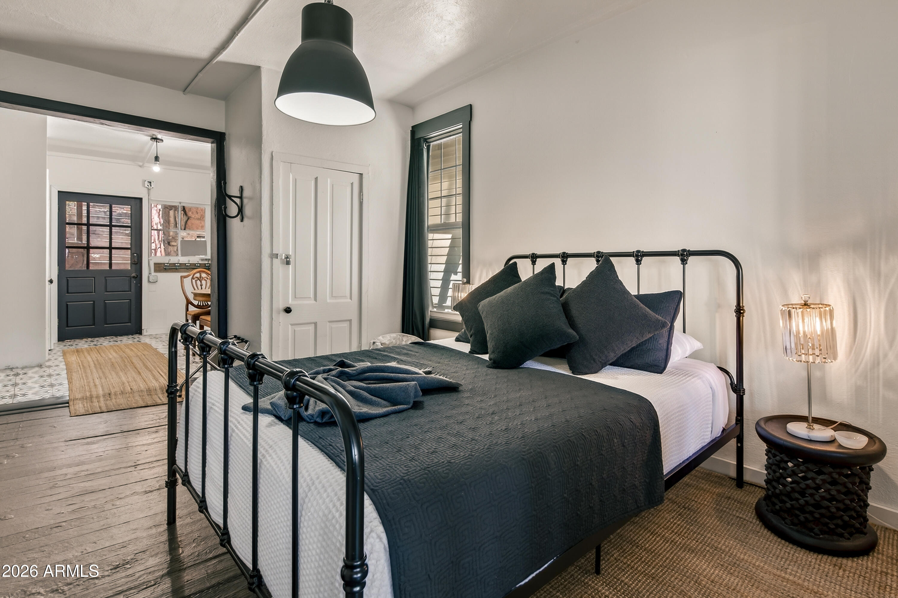 511 Main Street Jerome, AZ 86331 - Photo 39 of 67 a bedroom with a bed and wooden floor