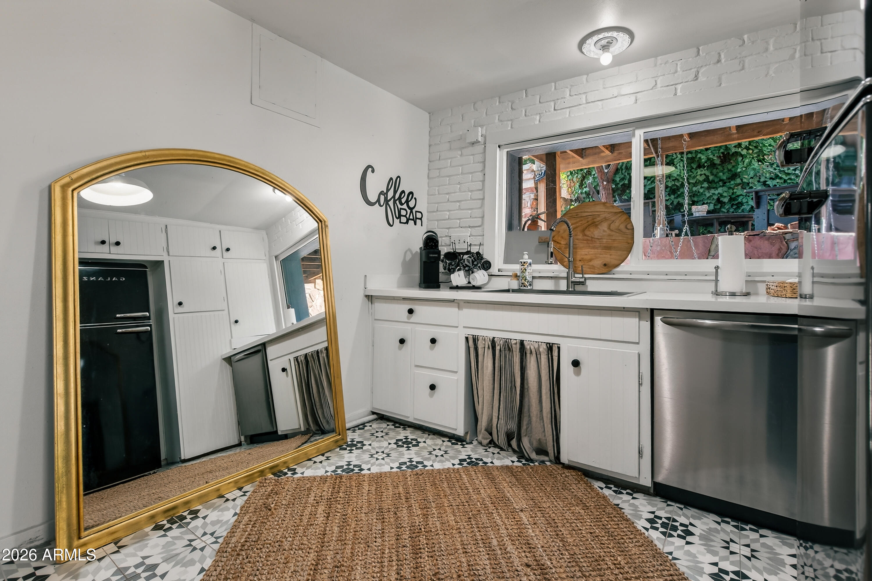 511 Main Street Jerome, AZ 86331 - Photo 42 of 67 a kitchen with stainless steel appliances granite countertop a sink and cabinets