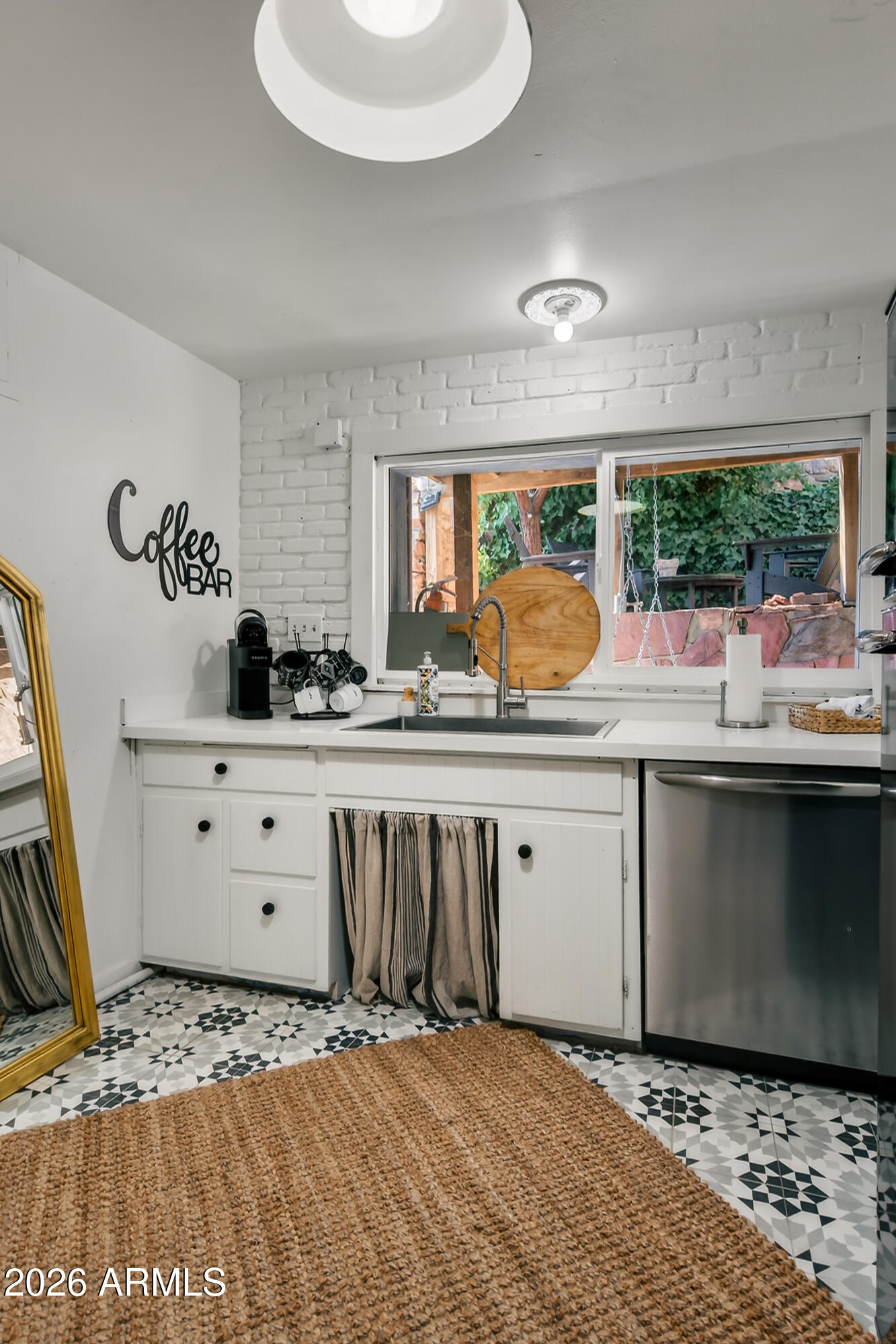 511 Main Street Jerome, AZ 86331 - Photo 43 of 67 a living room with stainless steel appliances kitchen island granite countertop a sink and a stove