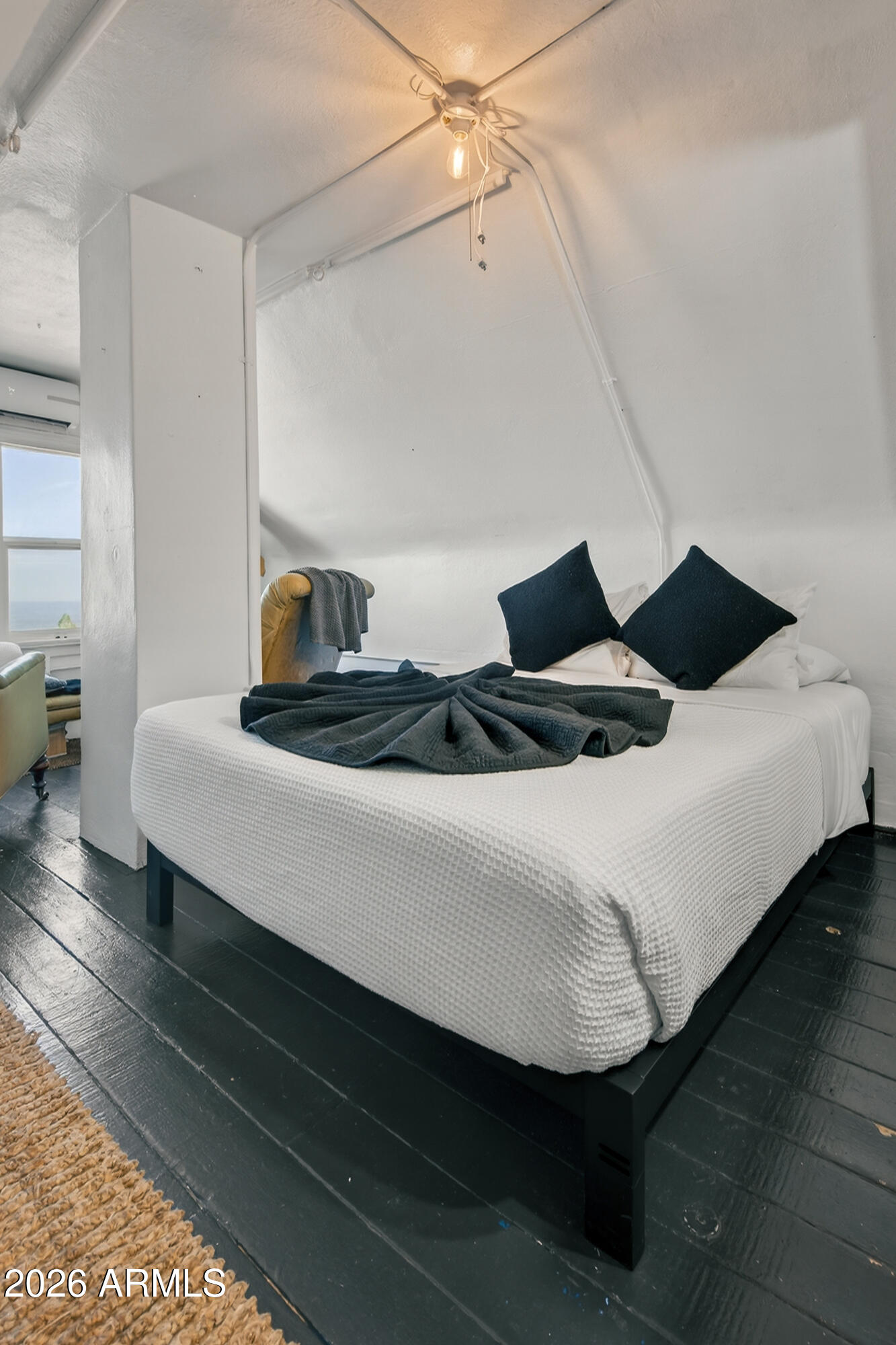 511 Main Street Jerome, AZ 86331 - Photo 53 of 67 a bedroom with a bed and wooden floor