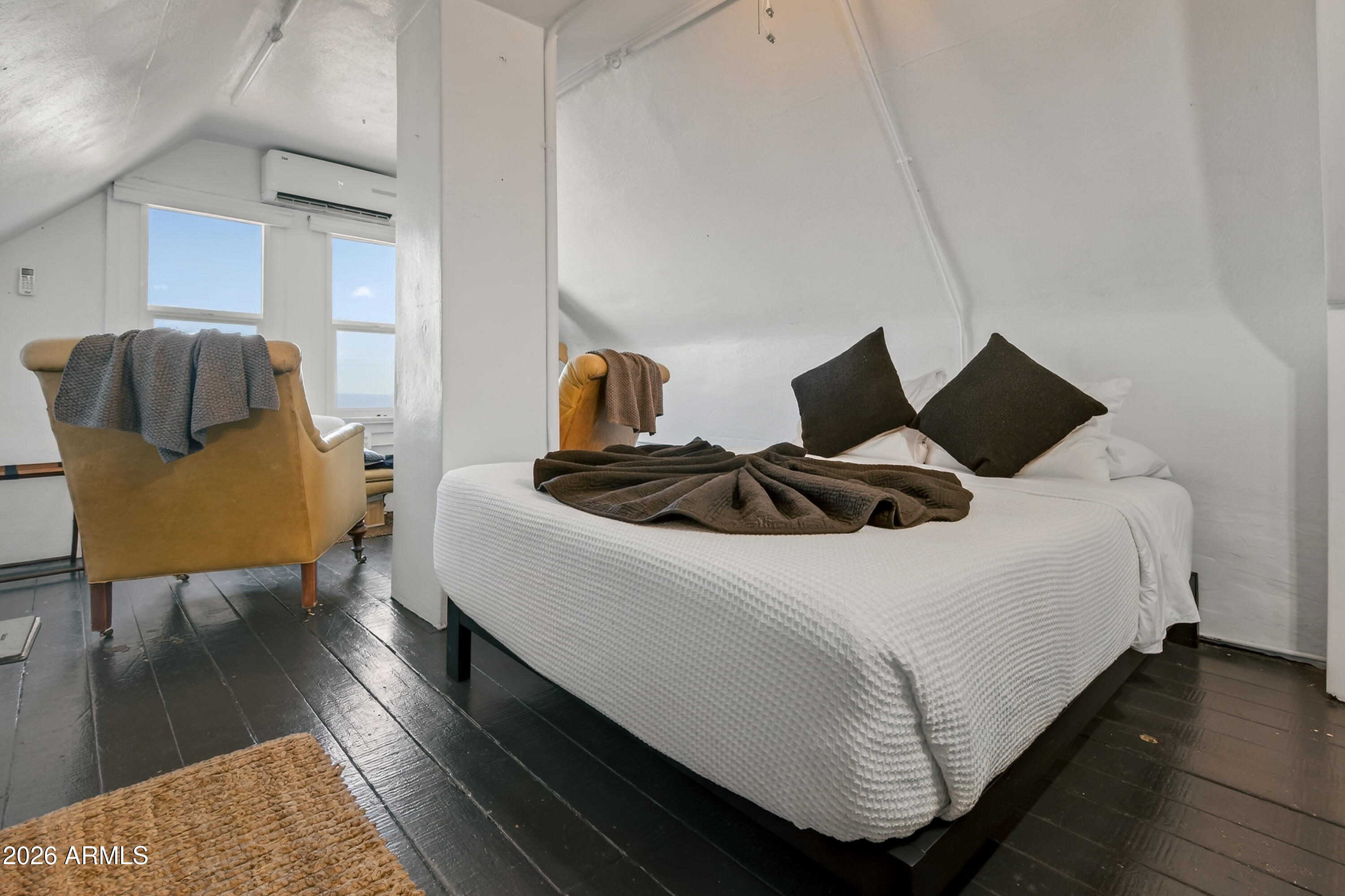 511 Main Street Jerome, AZ 86331 - Photo 59 of 67 a bedroom with a bed and wooden floor