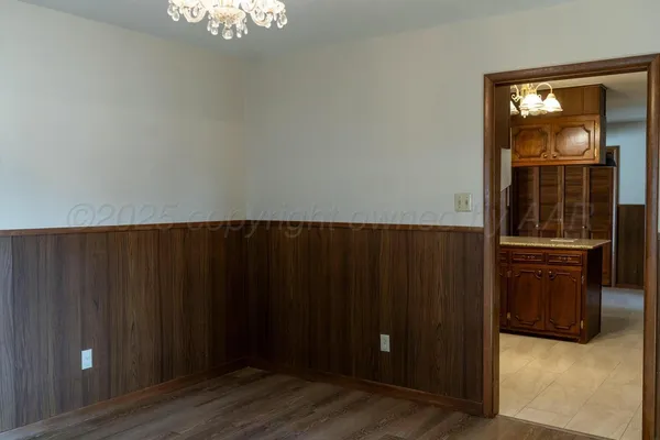 a kitchen with stainless steel appliances granite countertop a refrigerator and a microwave oven