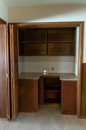 a view of a kitchen with a window