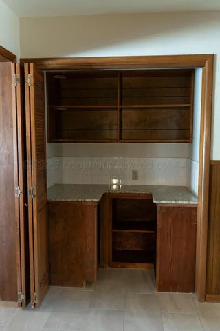 a view of a kitchen with a window