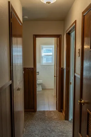 a bathroom with a granite countertop sink a toilet and a bathtub