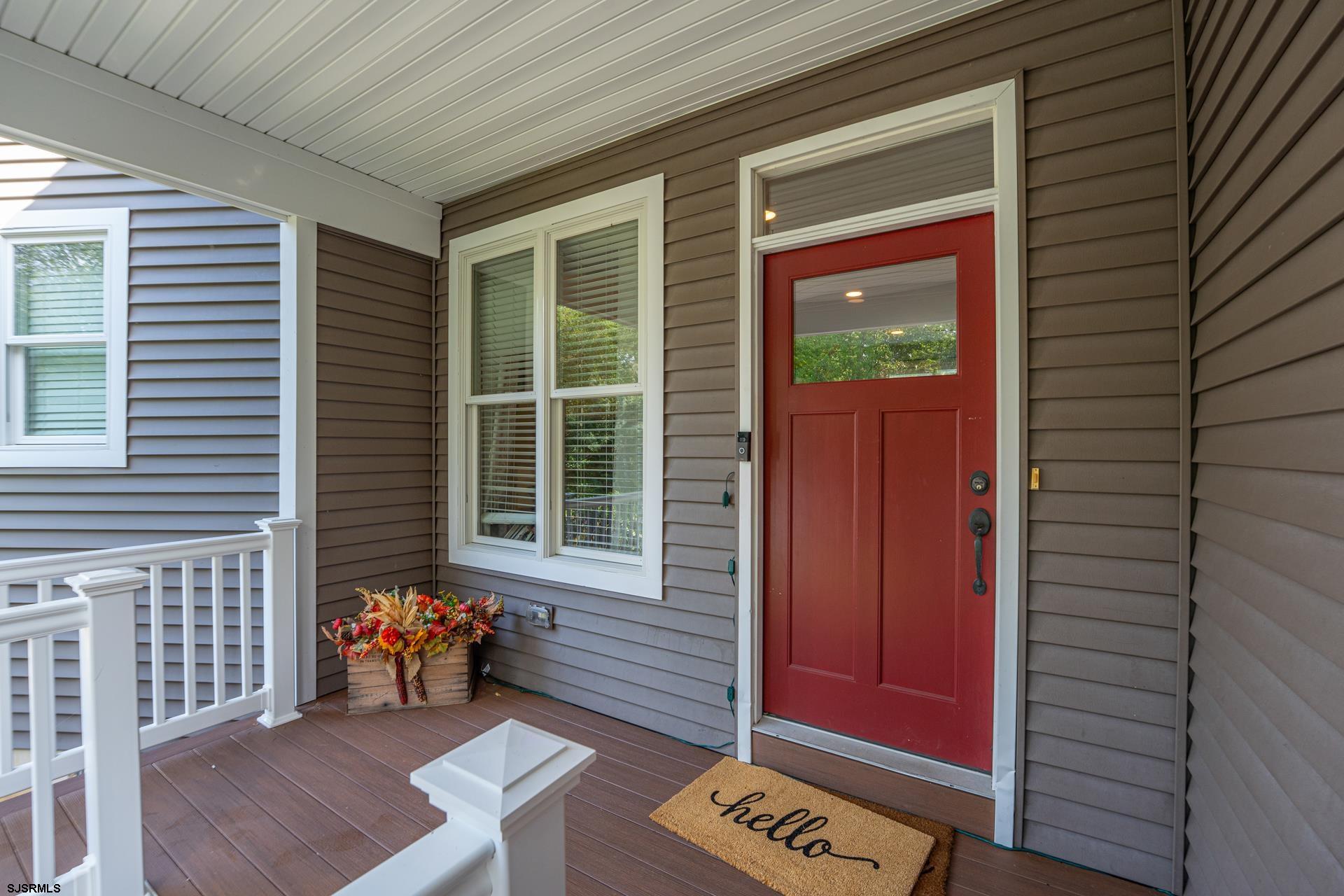 103 Tyler Road Ocean View, NJ 08230 - Photo 13 of 80 a view of a porch with a bench