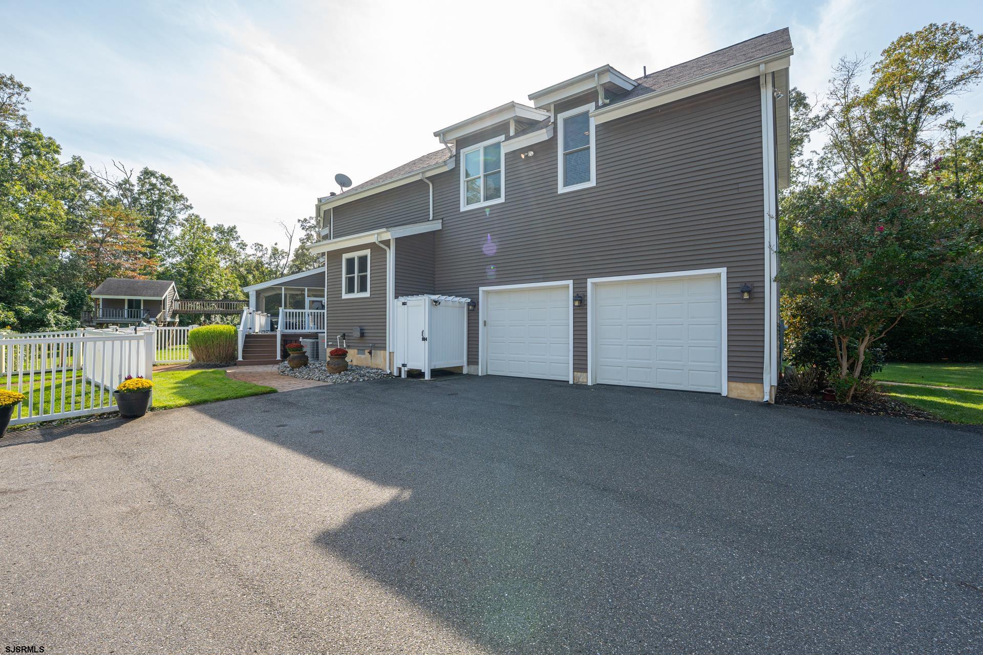 103 Tyler Road Ocean View, NJ 08230 - Photo 17 of 80 a view of a house with a backyard