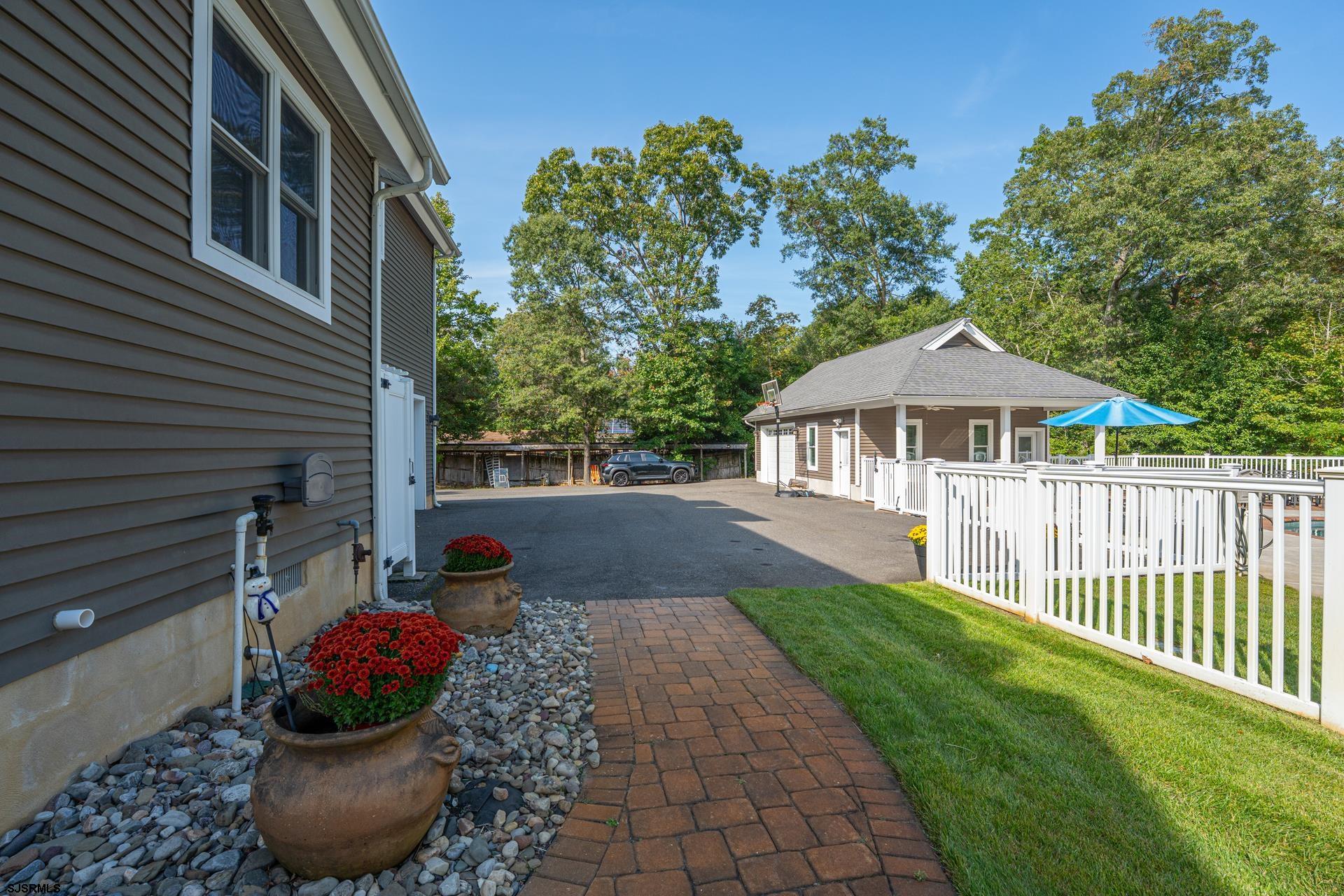 103 Tyler Road Ocean View, NJ 08230 - Photo 18 of 80 a front view of a house with a yard