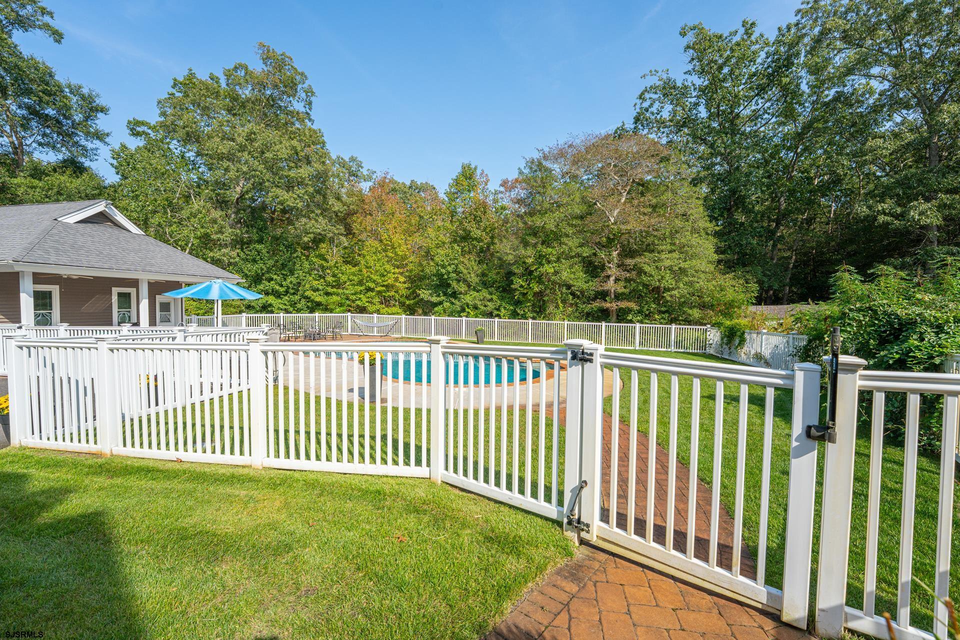 103 Tyler Road Ocean View, NJ 08230 - Photo 19 of 80 a view of a house with a wooden deck