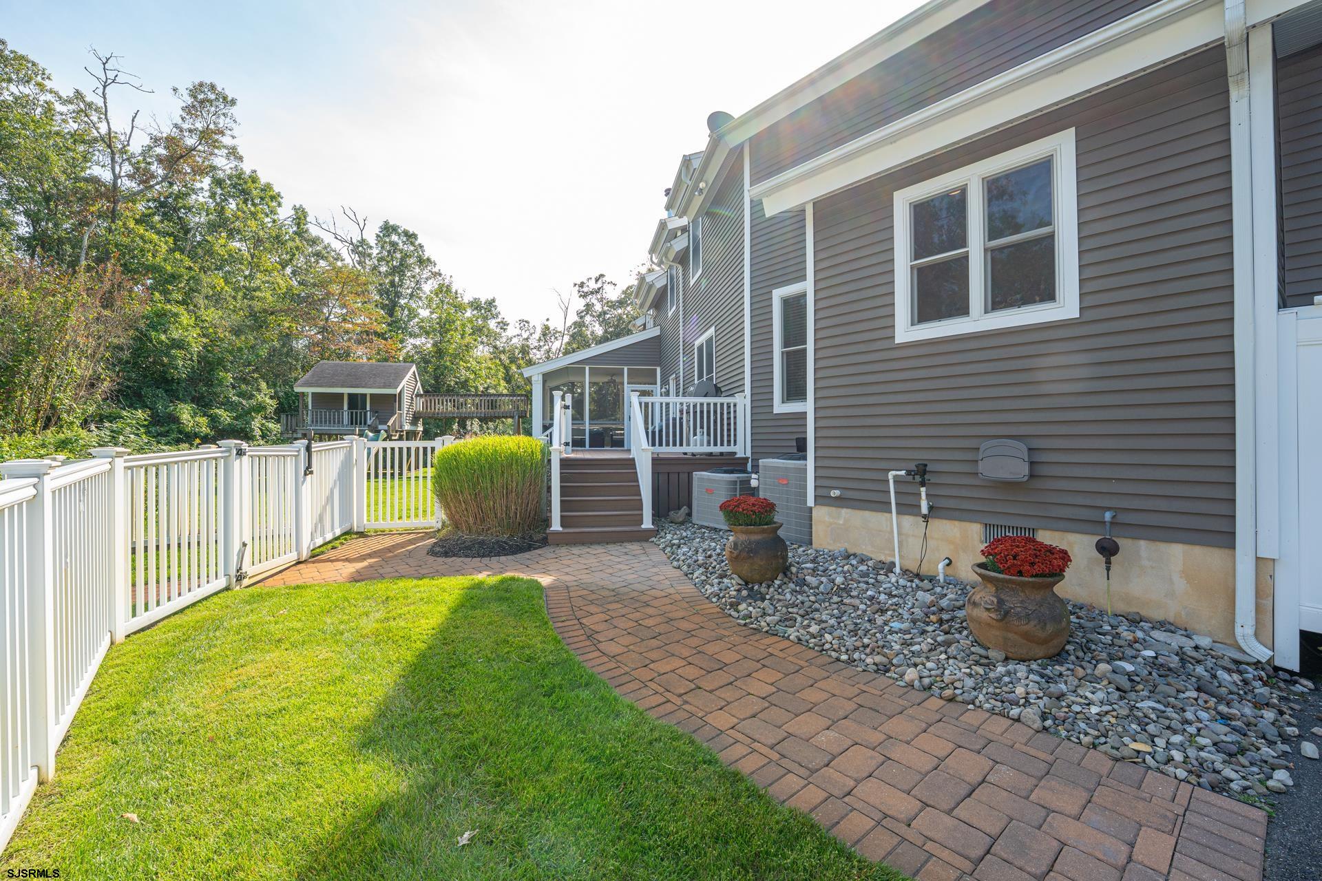 103 Tyler Road Ocean View, NJ 08230 - Photo 20 of 80 a view of a backyard with a patio