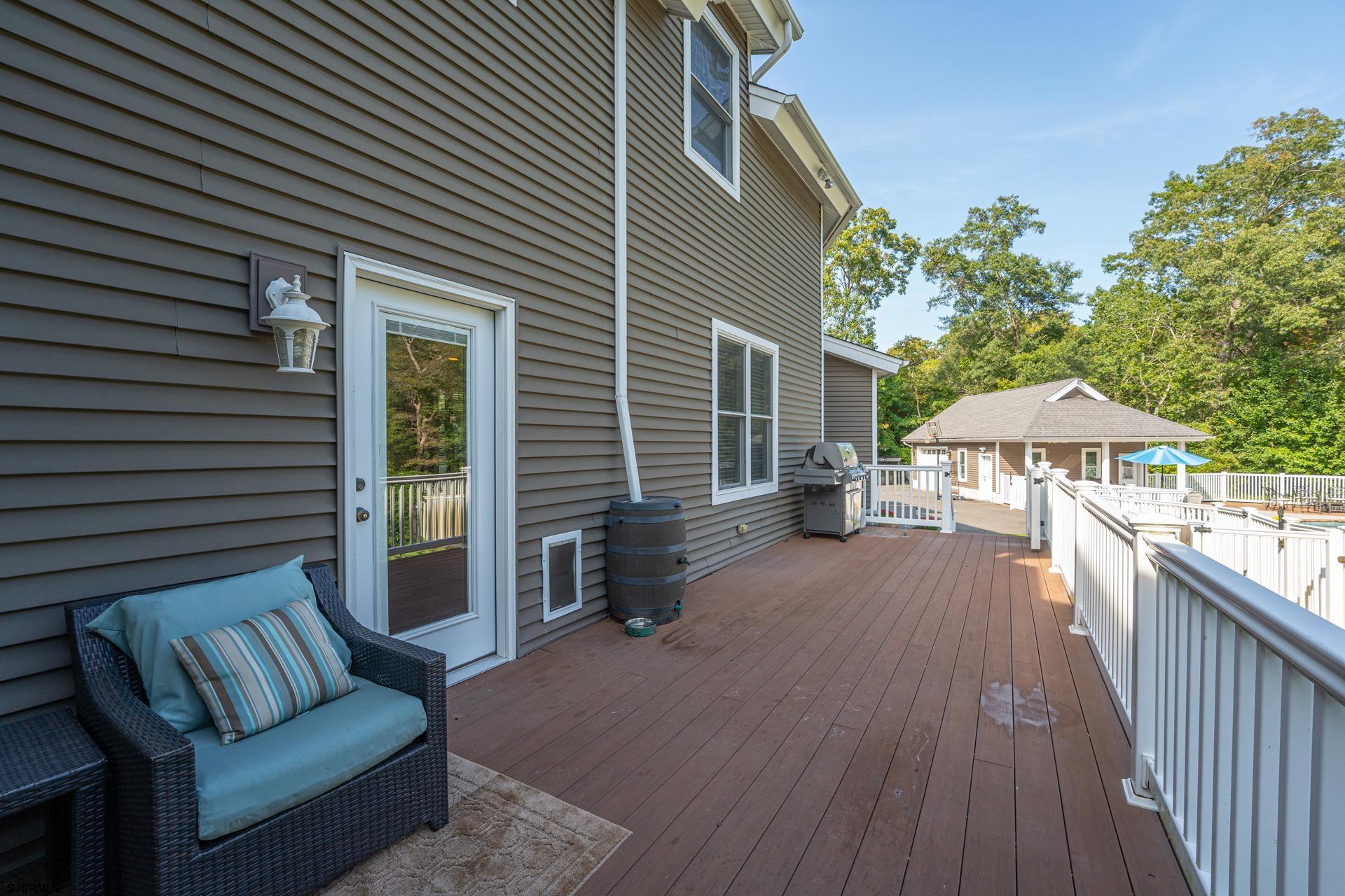 103 Tyler Road Ocean View, NJ 08230 - Photo 22 of 80 a view of a patio with couches under an umbrella