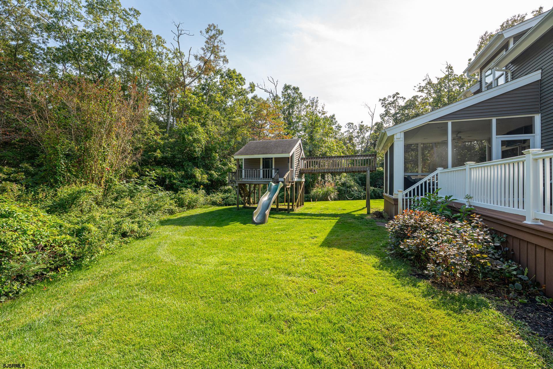 103 Tyler Road Ocean View, NJ 08230 - Photo 29 of 80 a view of a house with a yard porch and sitting area
