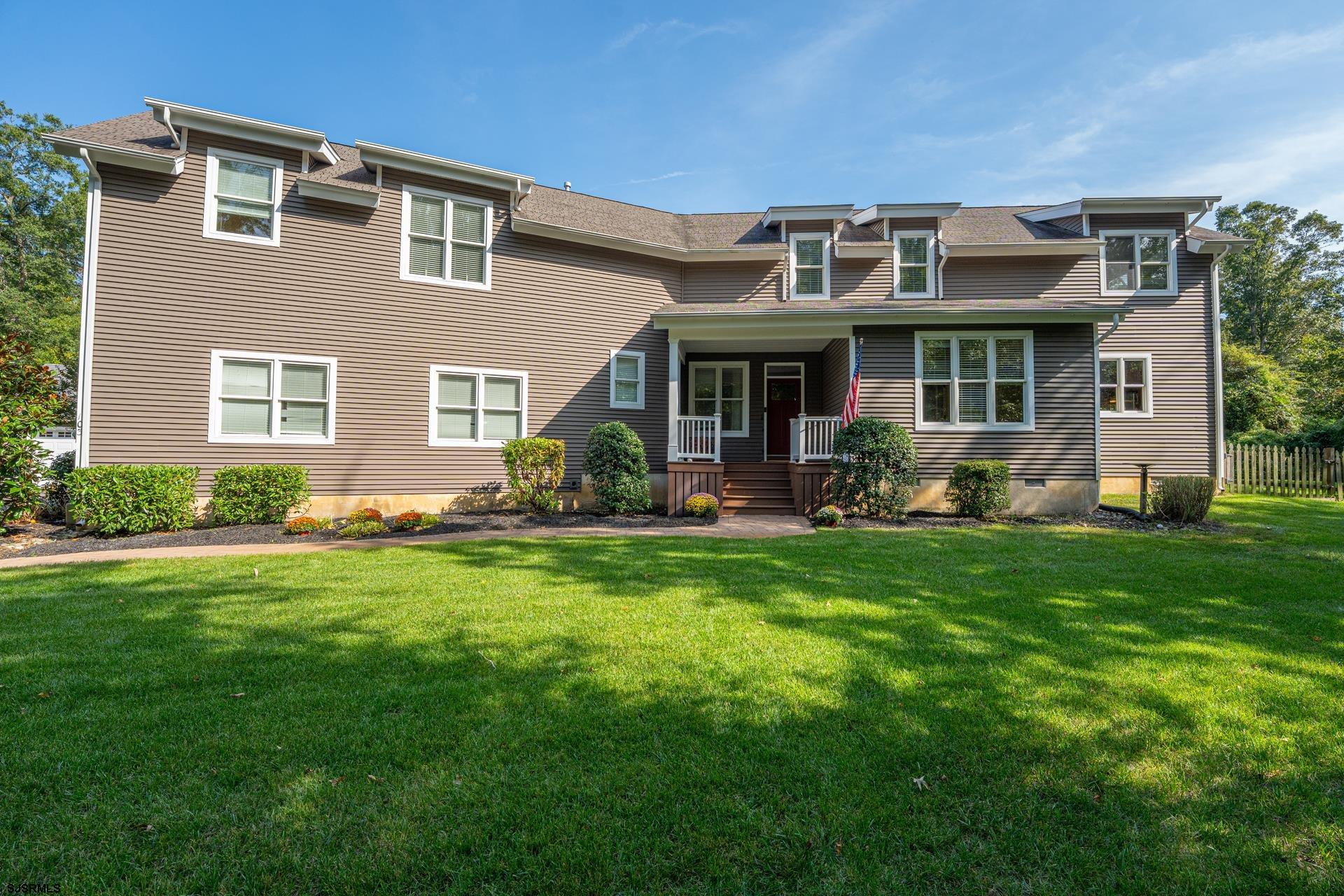 103 Tyler Road Ocean View, NJ 08230 - Photo 4 of 80 a front view of a house with a garden