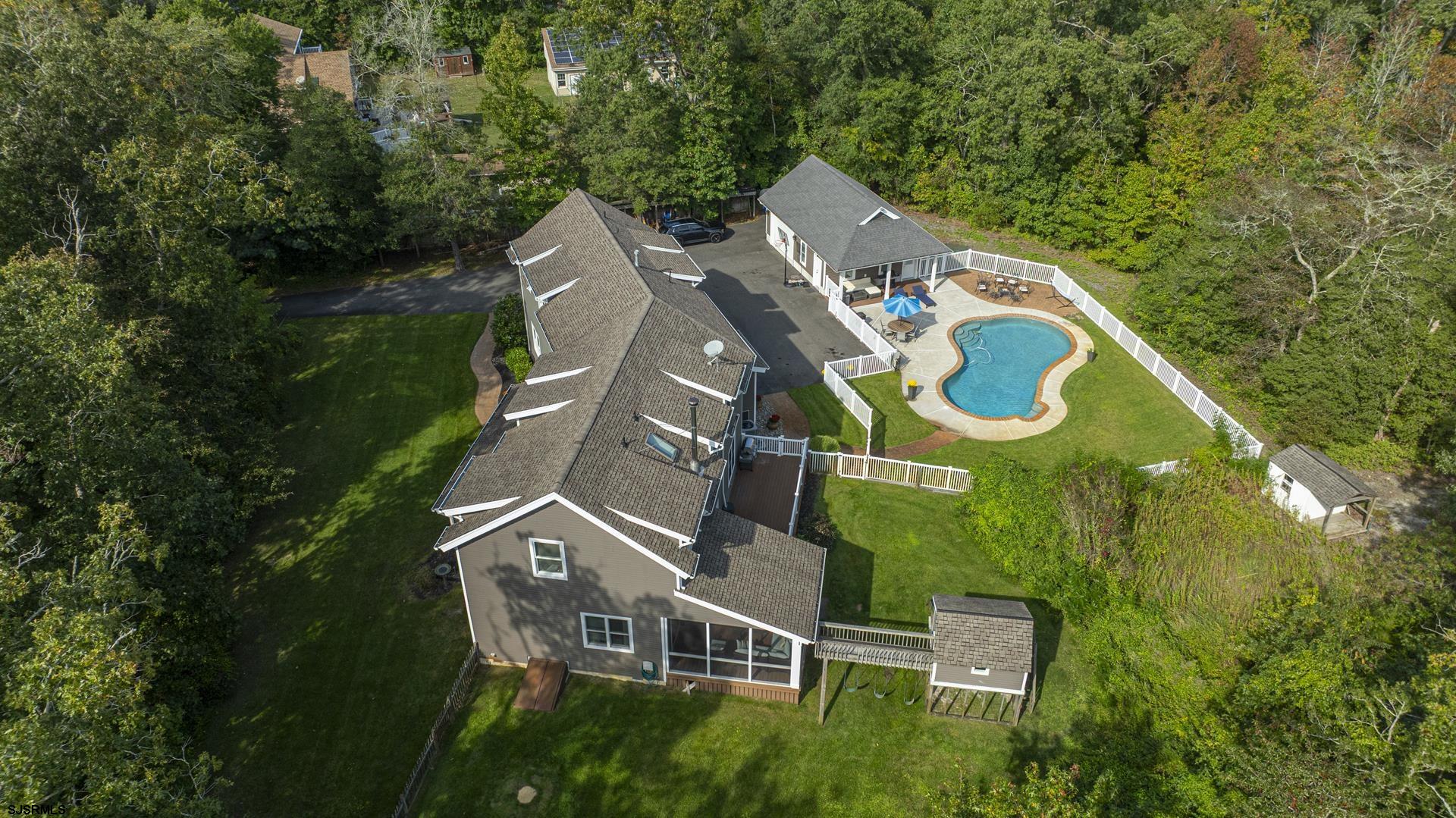 103 Tyler Road Ocean View, NJ 08230 - Photo 41 of 80 an aerial view of a house with garden space and trees