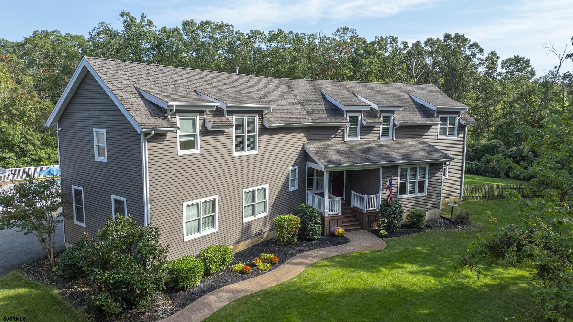 103 Tyler Road Ocean View, NJ 08230 - Photo 43 of 80 a aerial view of a house with yard and green space