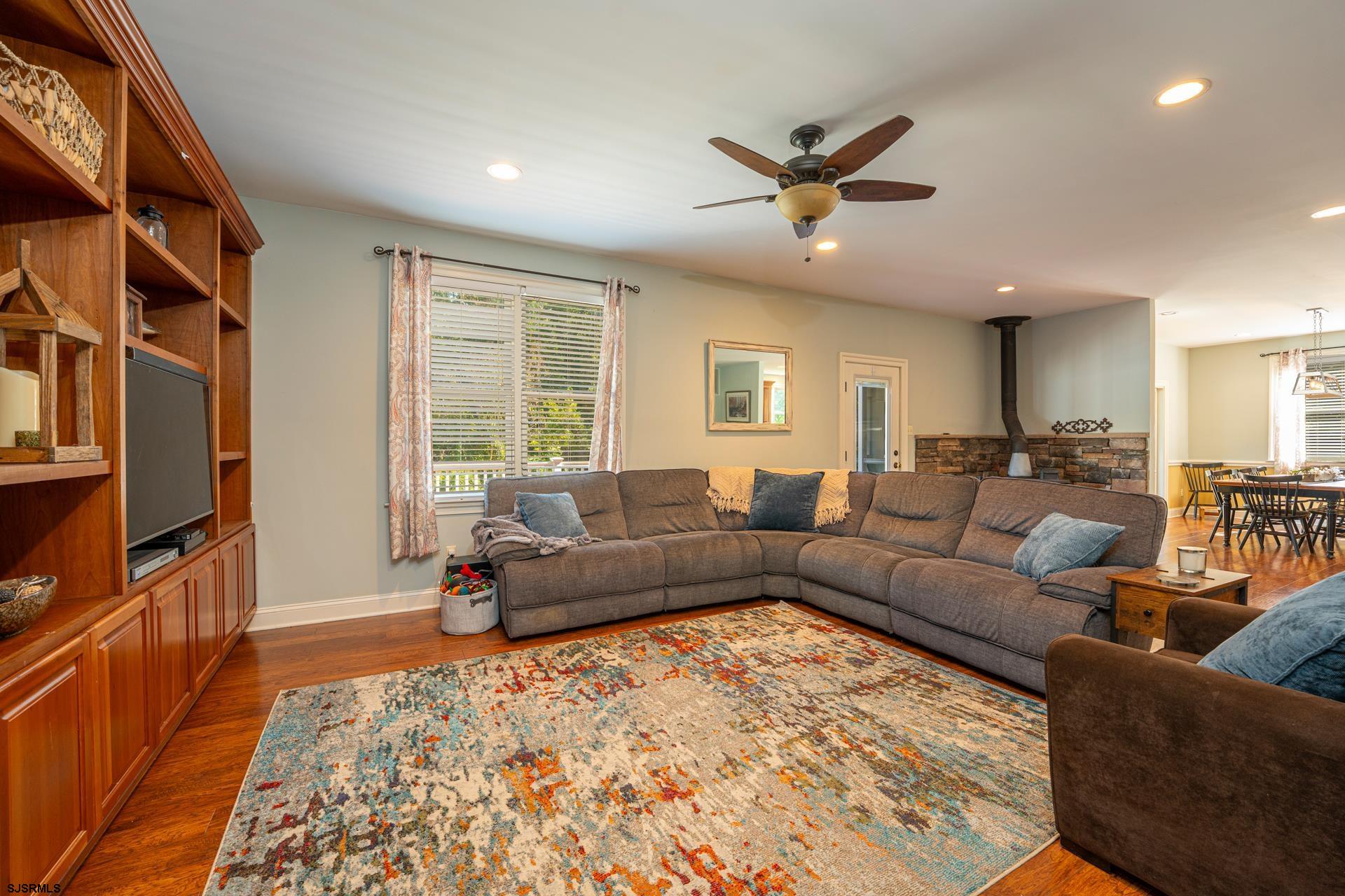 103 Tyler Road Ocean View, NJ 08230 - Photo 44 of 80 a living room with furniture ceiling fan and a rug