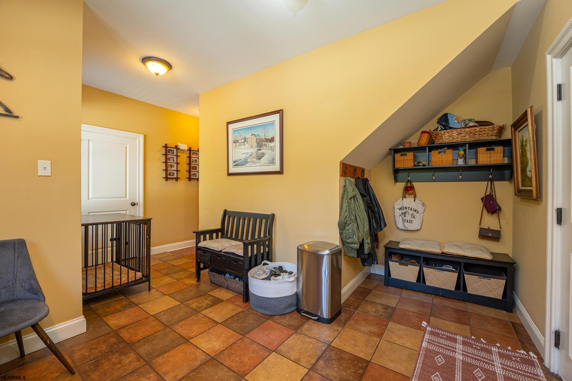 103 Tyler Road Ocean View, NJ 08230 - Photo 56 of 80 a living room with furniture and a painting on the wall