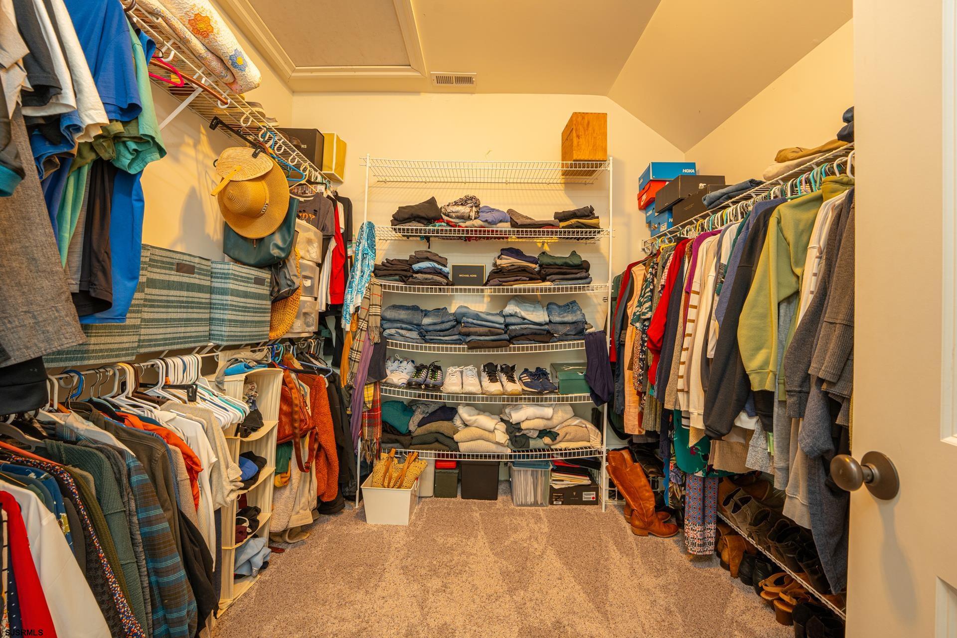 103 Tyler Road Ocean View, NJ 08230 - Photo 64 of 80 a view of walk in closet with clothes and shoes