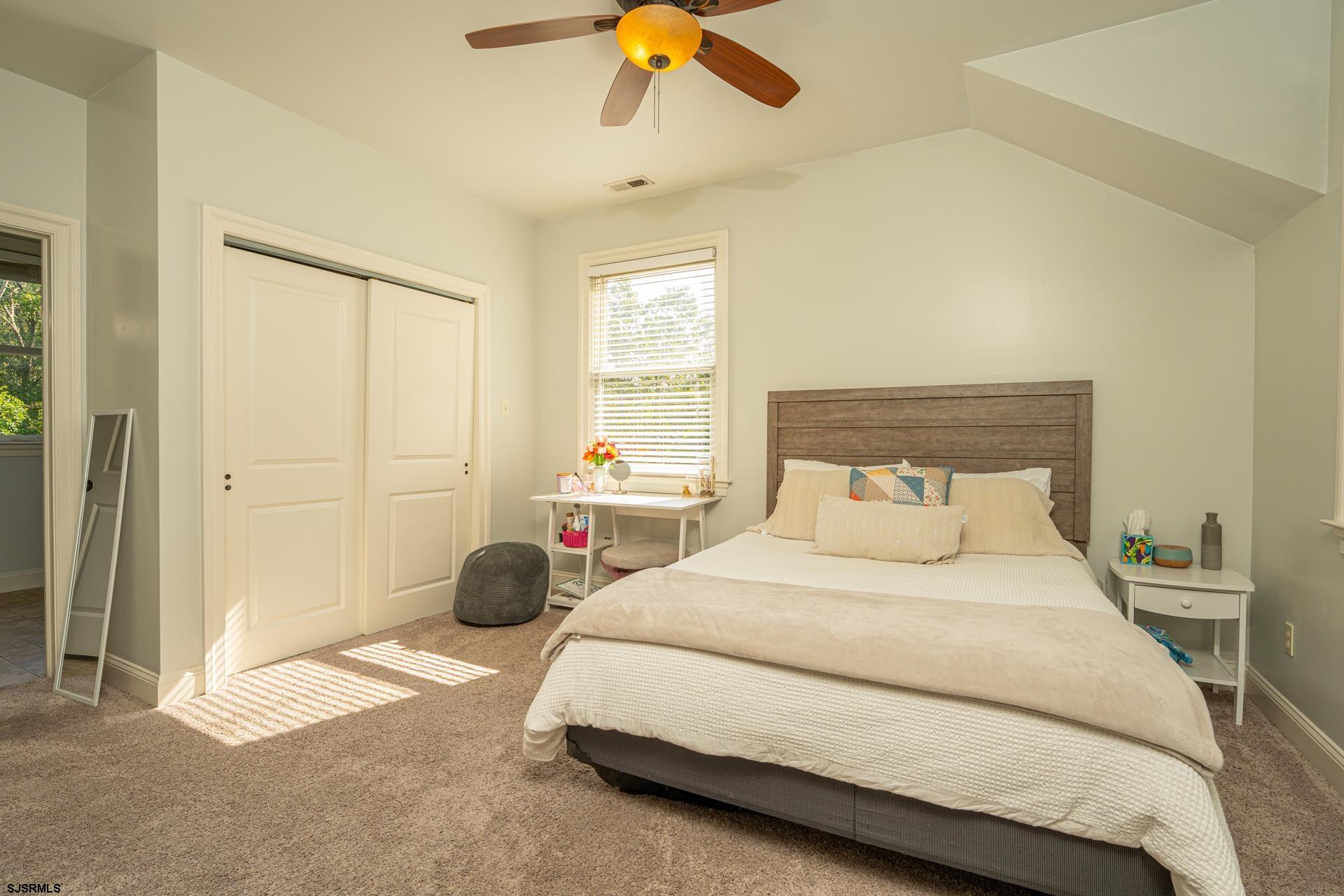 103 Tyler Road Ocean View, NJ 08230 - Photo 67 of 80 a bedroom with a bed and a large window