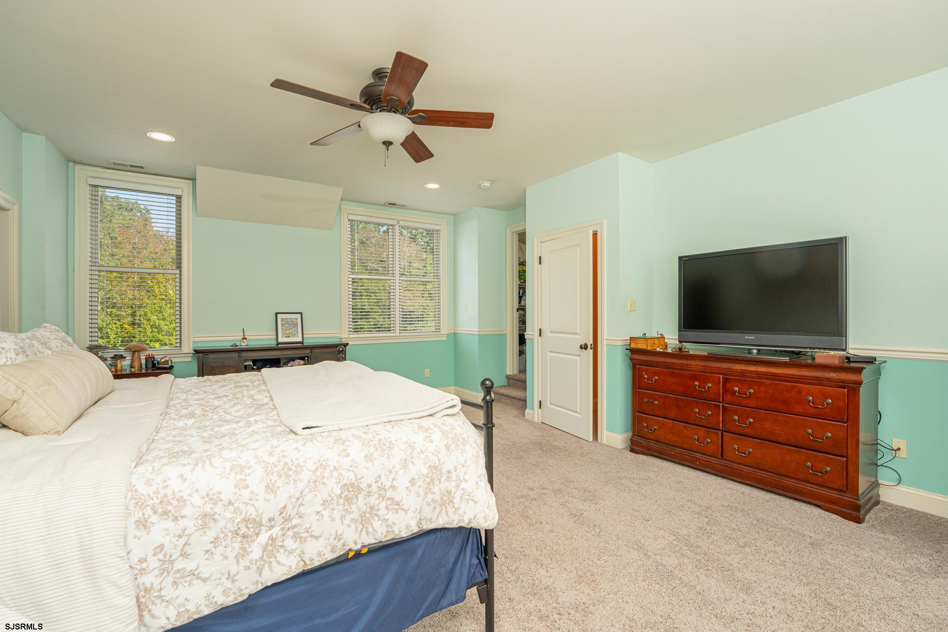 103 Tyler Road Ocean View, NJ 08230 - Photo 70 of 80 a bedroom with a bed and a flat screen tv