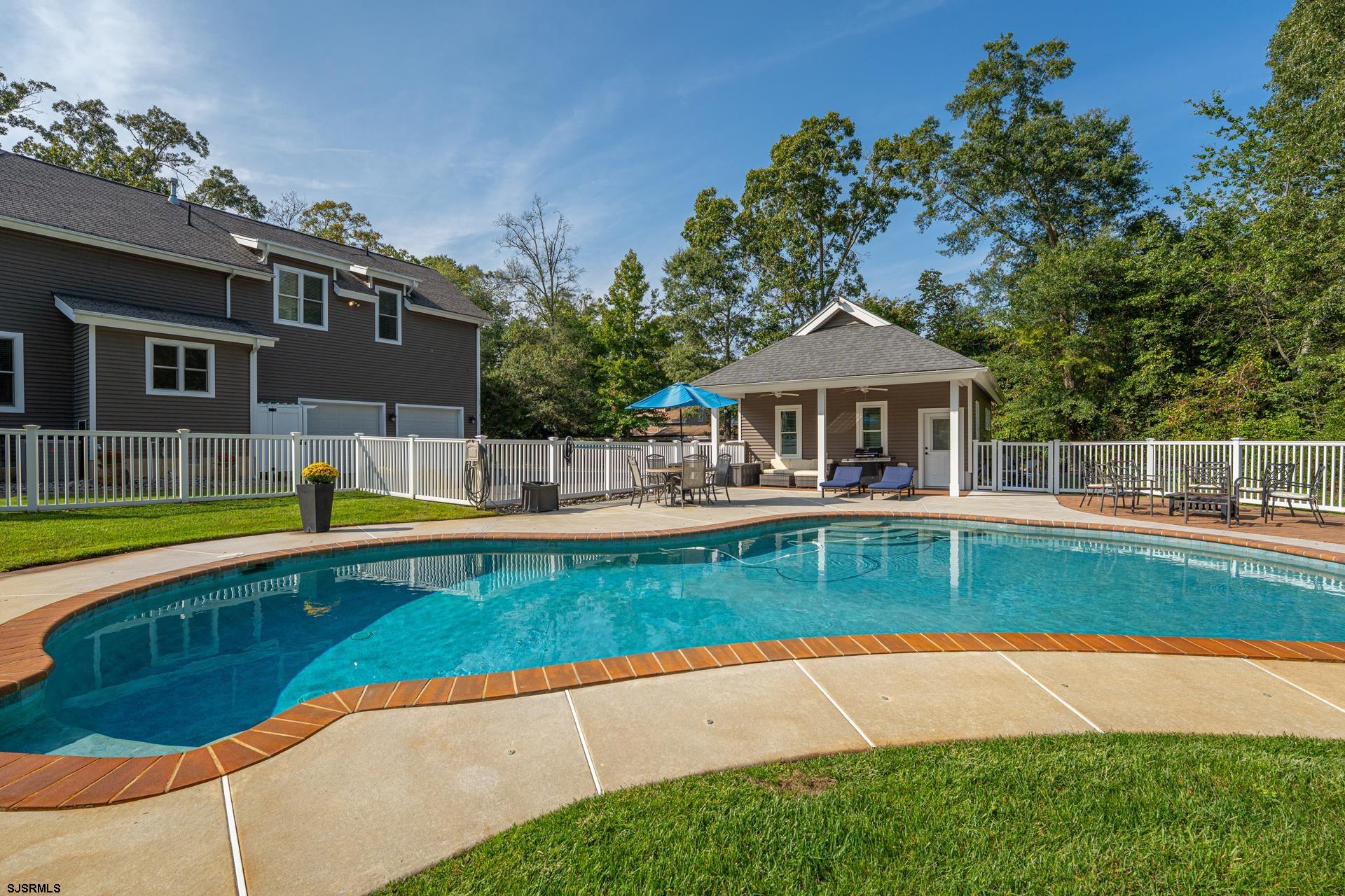 103 Tyler Road Ocean View, NJ 08230 - Photo 7 of 80 a view of a house with a swimming pool