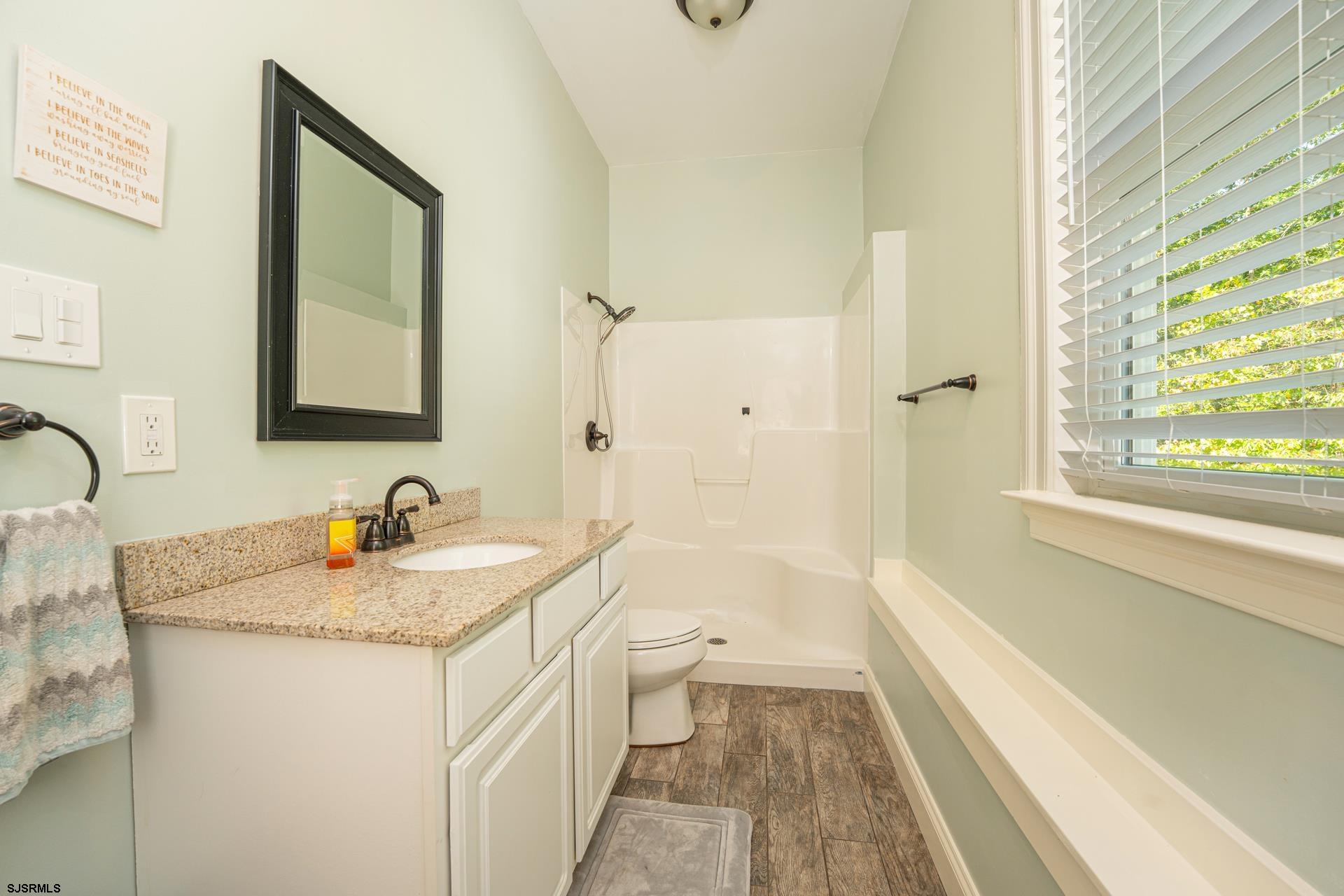 103 Tyler Road Ocean View, NJ 08230 - Photo 75 of 80 a bathroom with a granite countertop sink toilet and shower