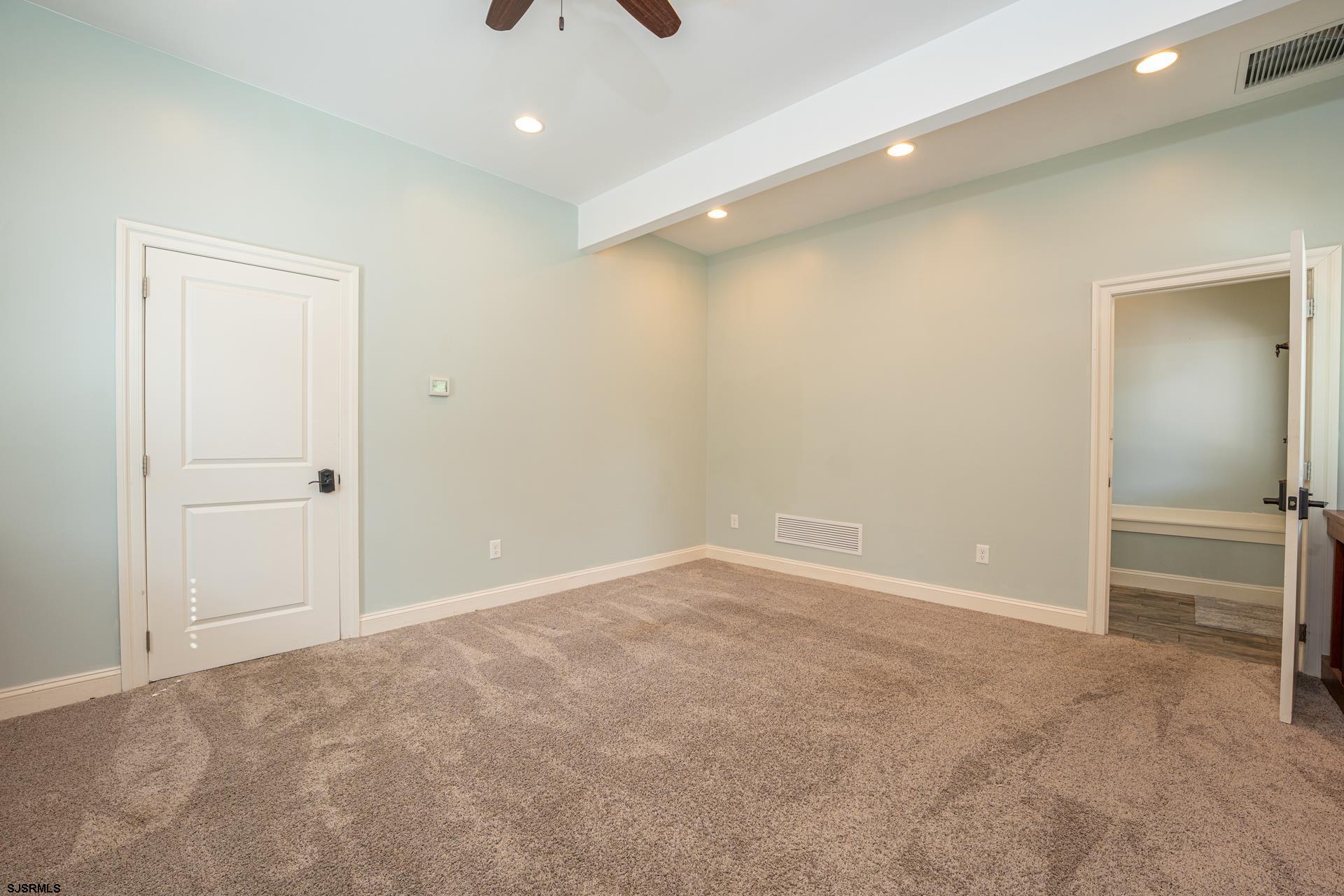 103 Tyler Road Ocean View, NJ 08230 - Photo 77 of 80 an empty room with closet and a chandelier fan