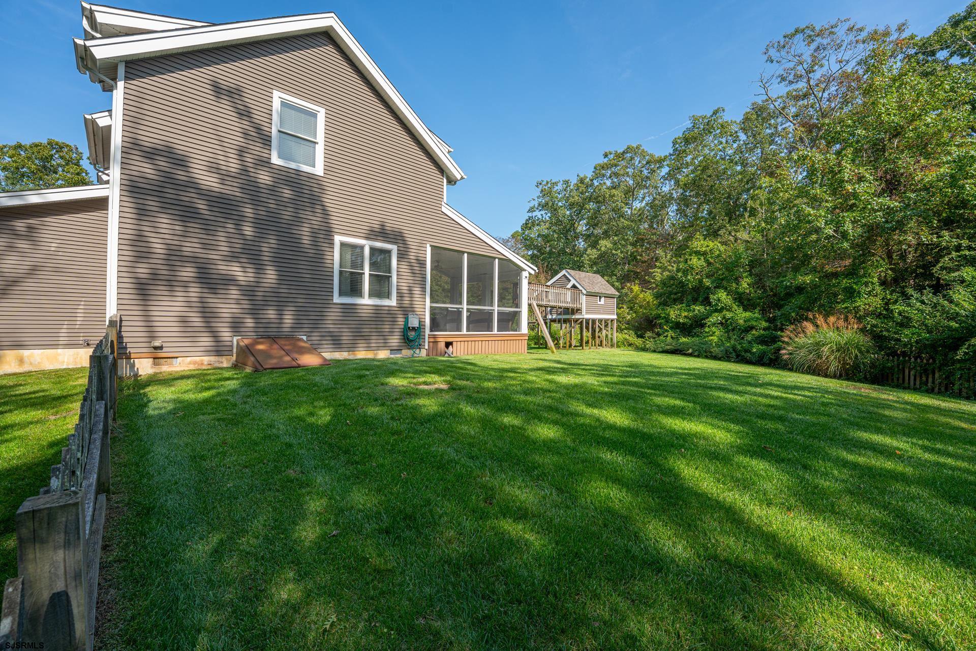 103 Tyler Road Ocean View, NJ 08230 - Photo 10 of 80 a front view of house with yard and green space