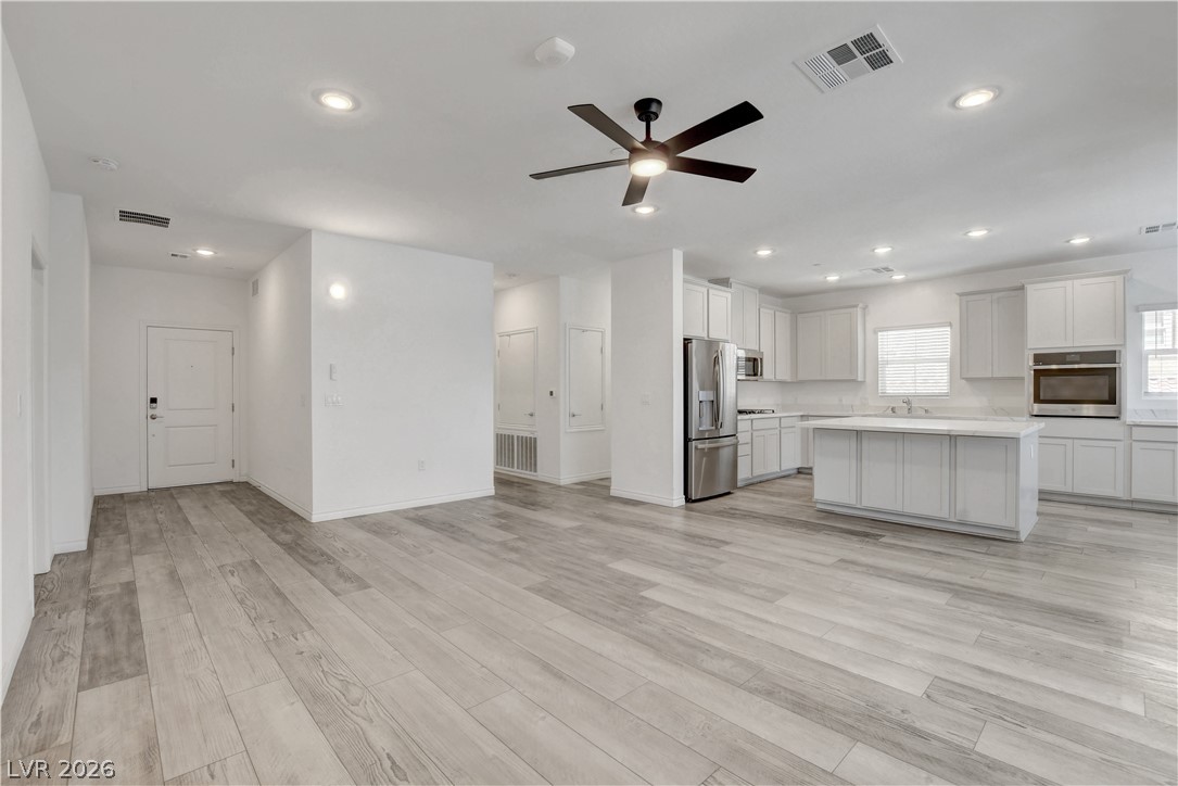 2555 Hampton Road, Unit 2207 Henderson, NV 89052 - Photo 9 of 74 An open concept living area transitions seamlessly into a well-appointed kitchen.