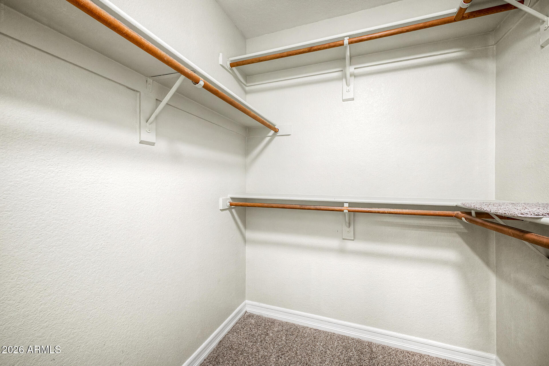 4102 East Rock Wren Road Phoenix, AZ 85044 - Photo 15 of 25 a view of a room with racks on the wall