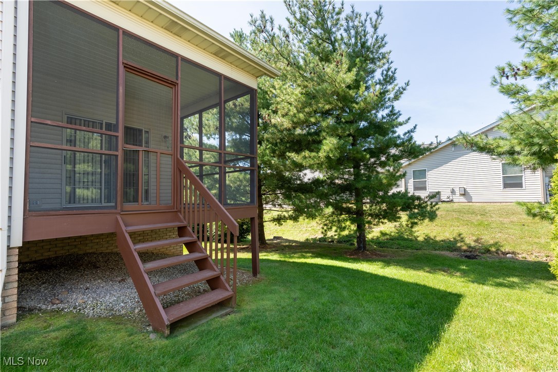 2603 Charing Cross Road Northwest Canton, OH 44708 - Photo 22 of 24 View of yard with a sunroom