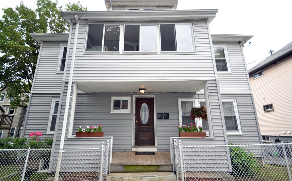 17 Laurel Terrace Somerville, MA 02143 - Photo 1 of 28 a front view of a house with glass windows and garage