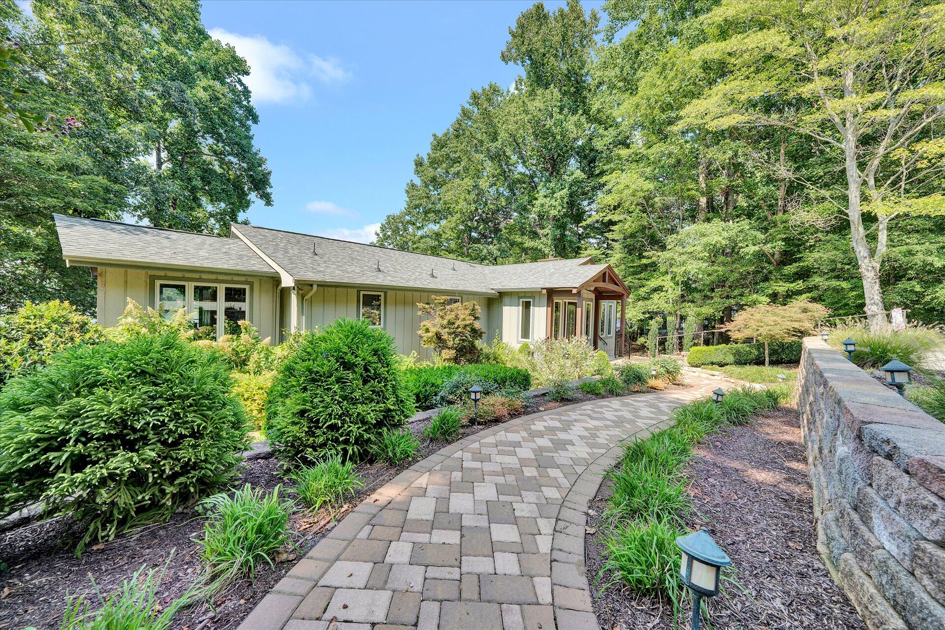 85 Chickadee Circle Moneta, VA 24121 - Photo 2 of 57 a front view of a house with garden