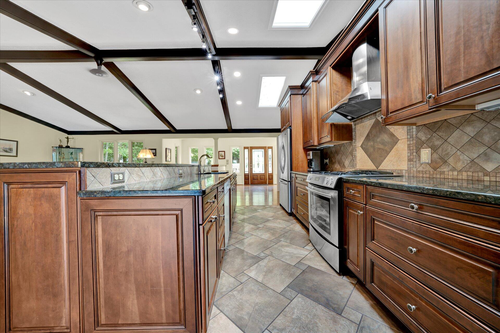 85 Chickadee Circle Moneta, VA 24121 - Photo 13 of 57 a kitchen with stainless steel appliances granite countertop a sink and cabinets