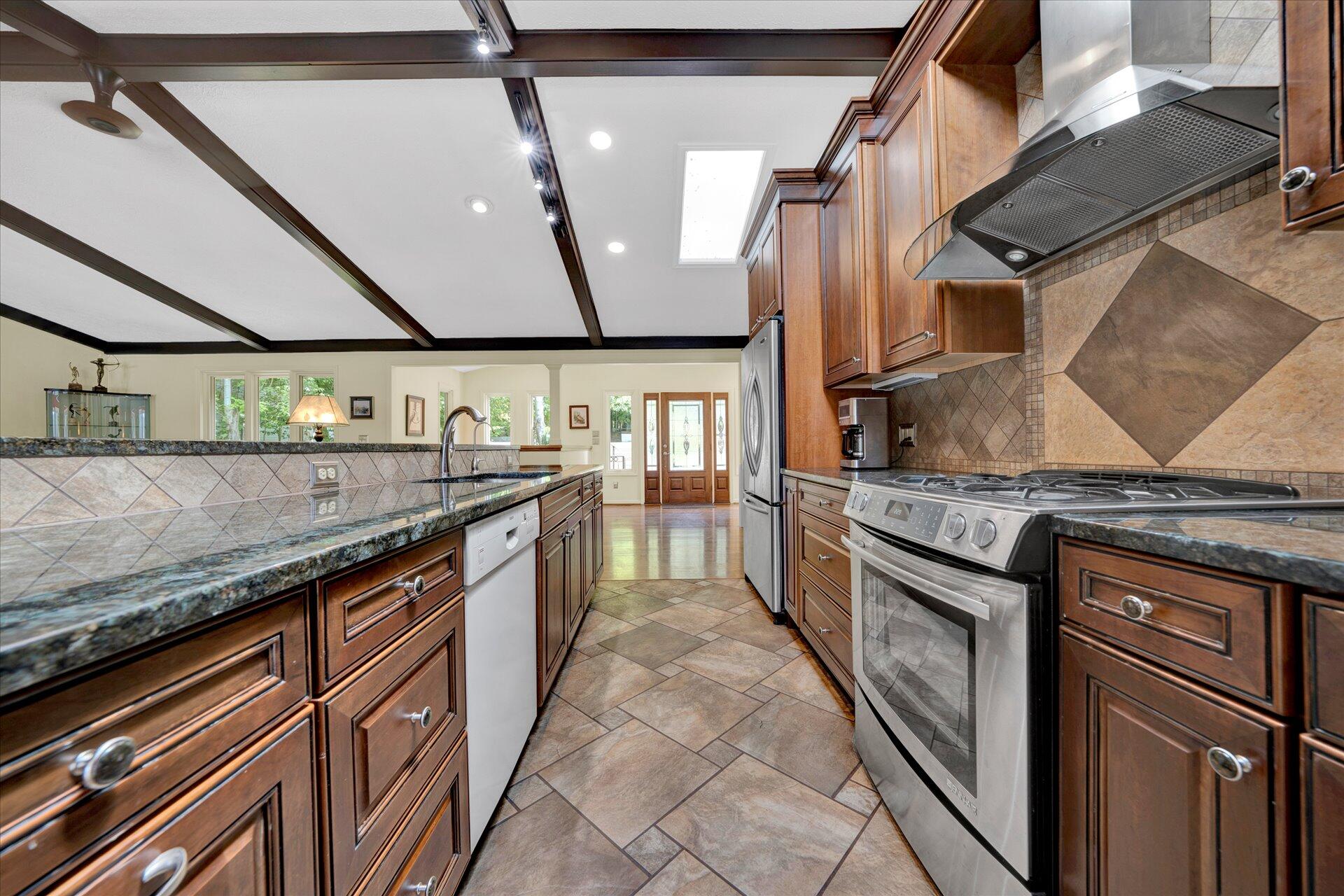 85 Chickadee Circle Moneta, VA 24121 - Photo 14 of 57 a kitchen with stainless steel appliances granite countertop a stove and a sink