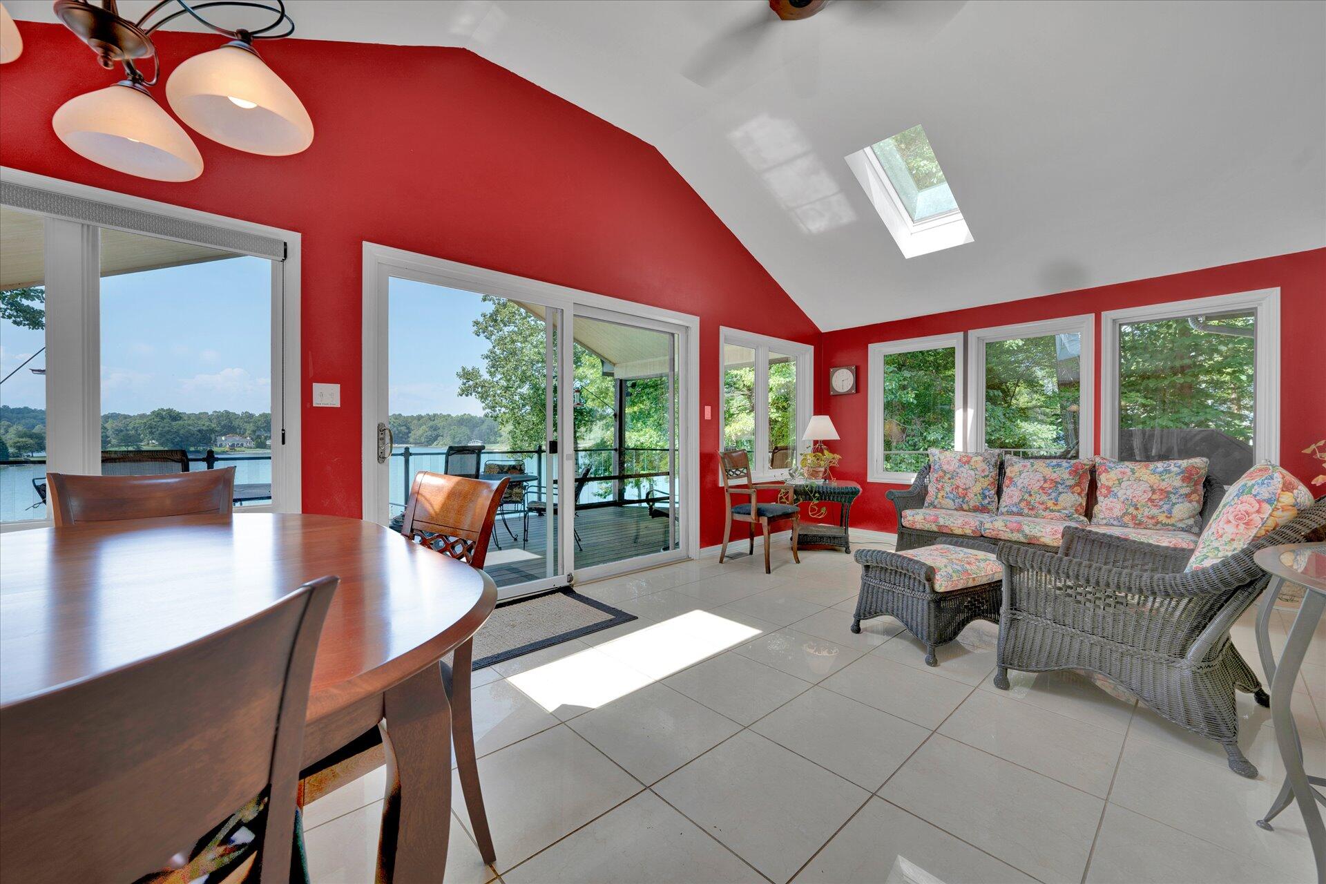 85 Chickadee Circle Moneta, VA 24121 - Photo 16 of 57 a living room with furniture and floor to ceiling windows