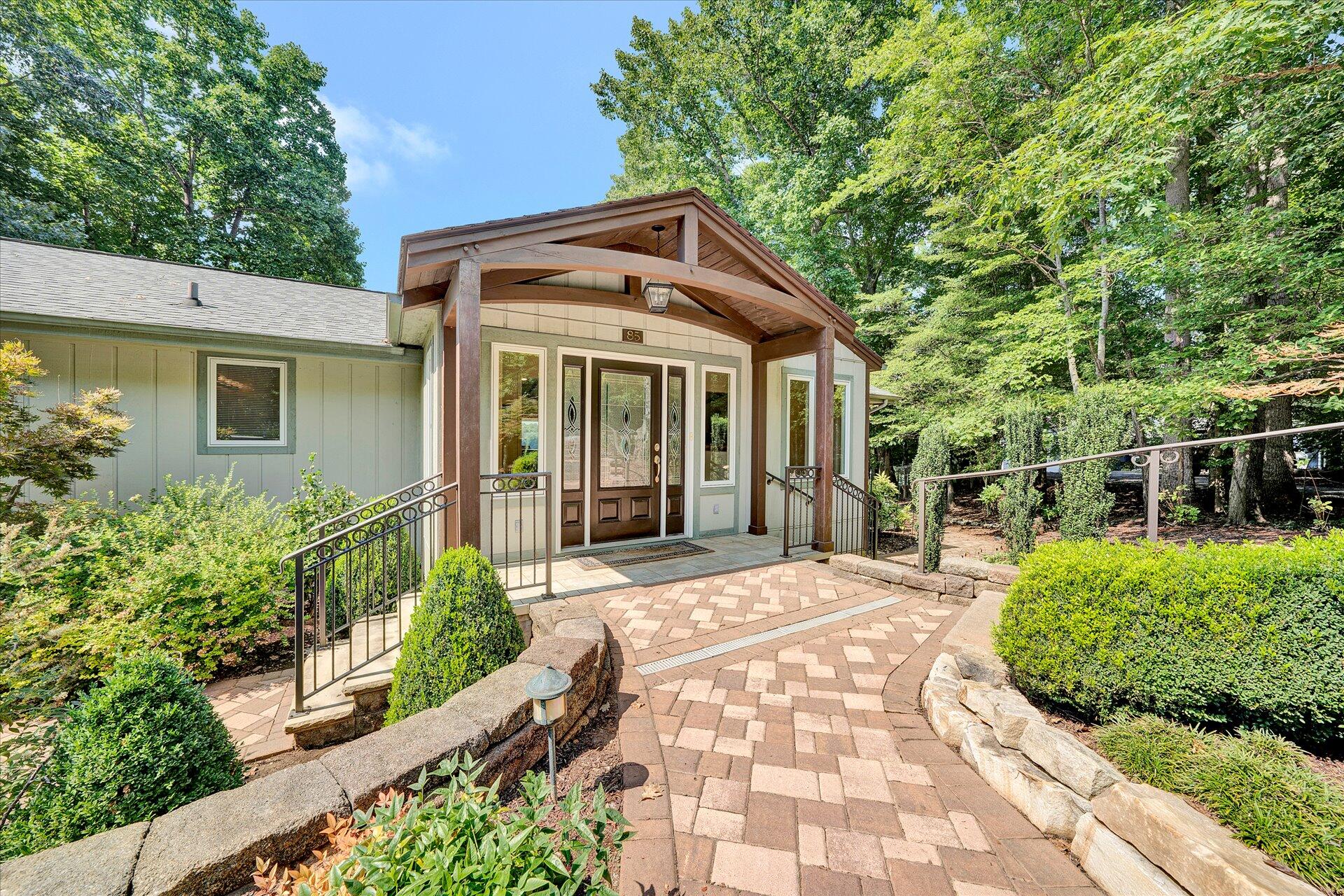 85 Chickadee Circle Moneta, VA 24121 - Photo 3 of 57 a front view of a house with garden