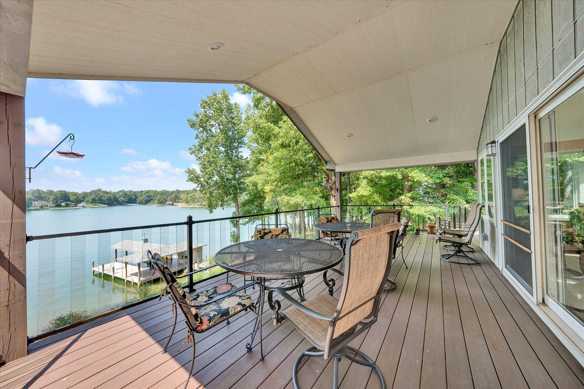 85 Chickadee Circle Moneta, VA 24121 - Photo 22 of 57 a view of a chairs and table on the wooden deck
