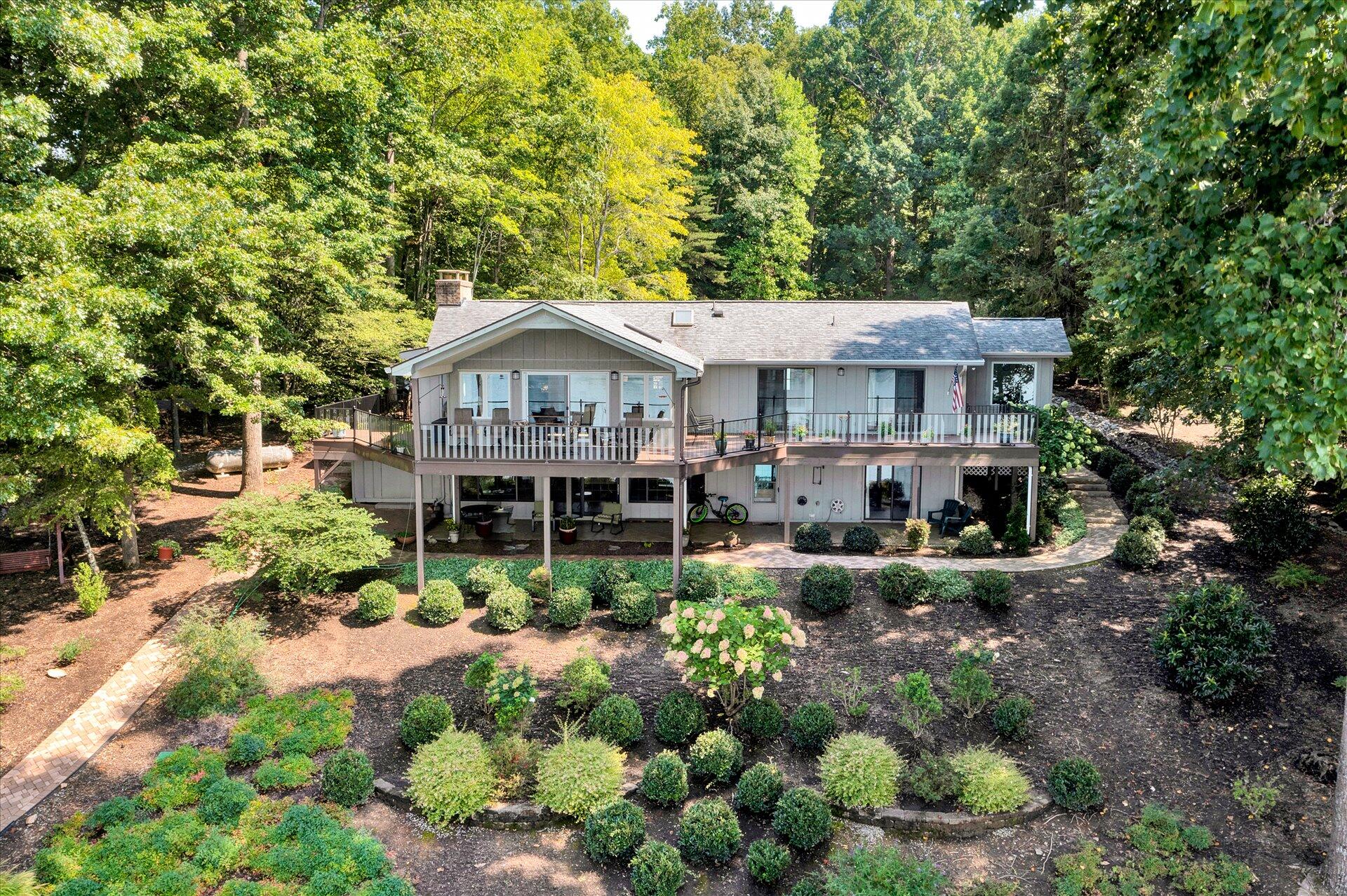 85 Chickadee Circle Moneta, VA 24121 - Photo 4 of 57 a front view of a house with a yard and fountain