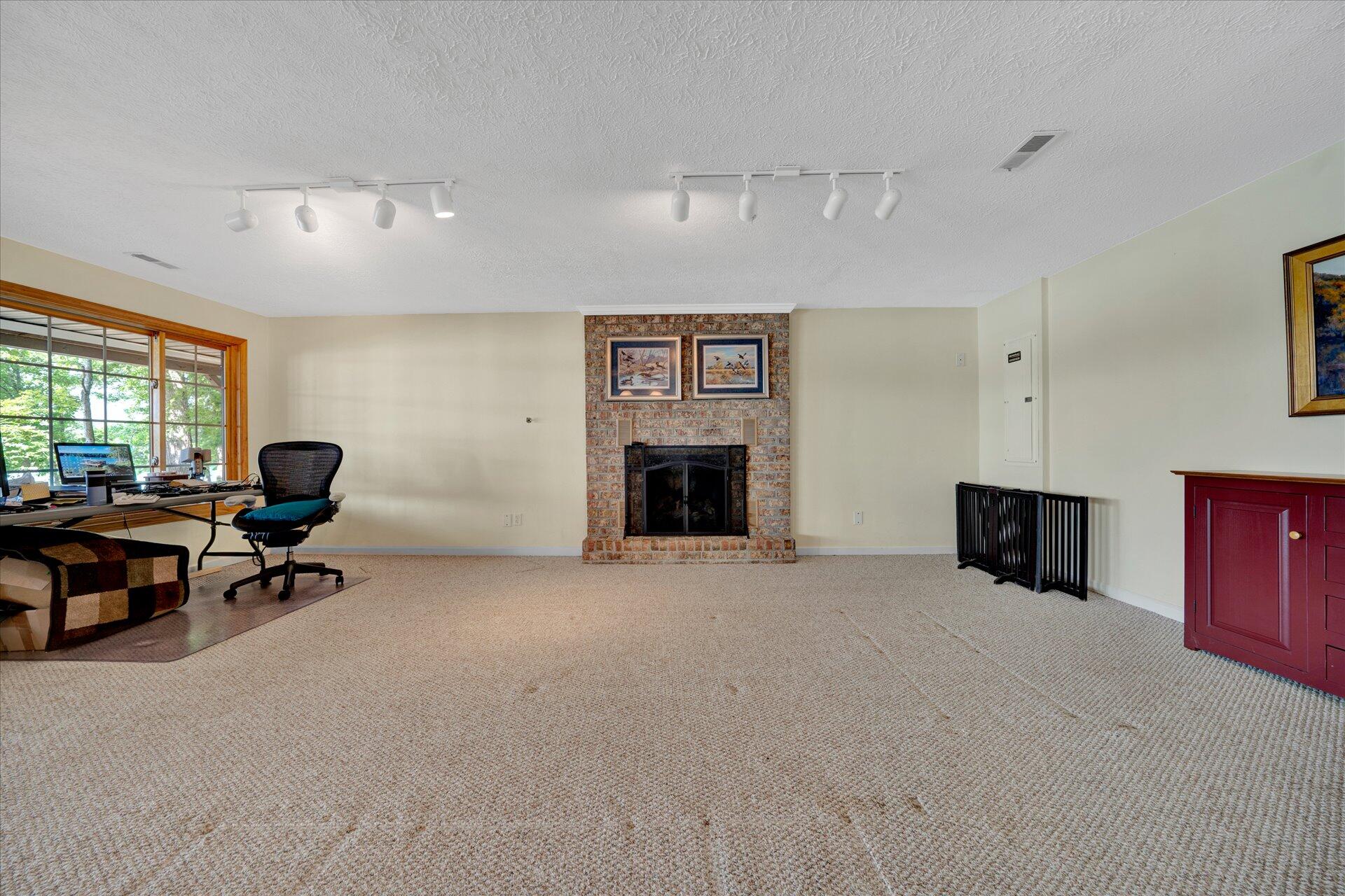 85 Chickadee Circle Moneta, VA 24121 - Photo 37 of 57 a living room with furniture and a fireplace