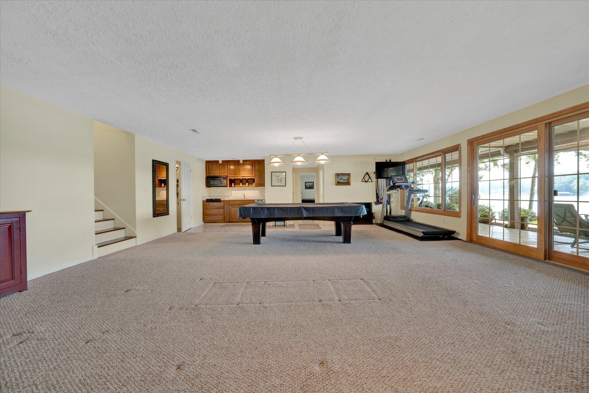 85 Chickadee Circle Moneta, VA 24121 - Photo 38 of 57 a view of an empty room with large windows