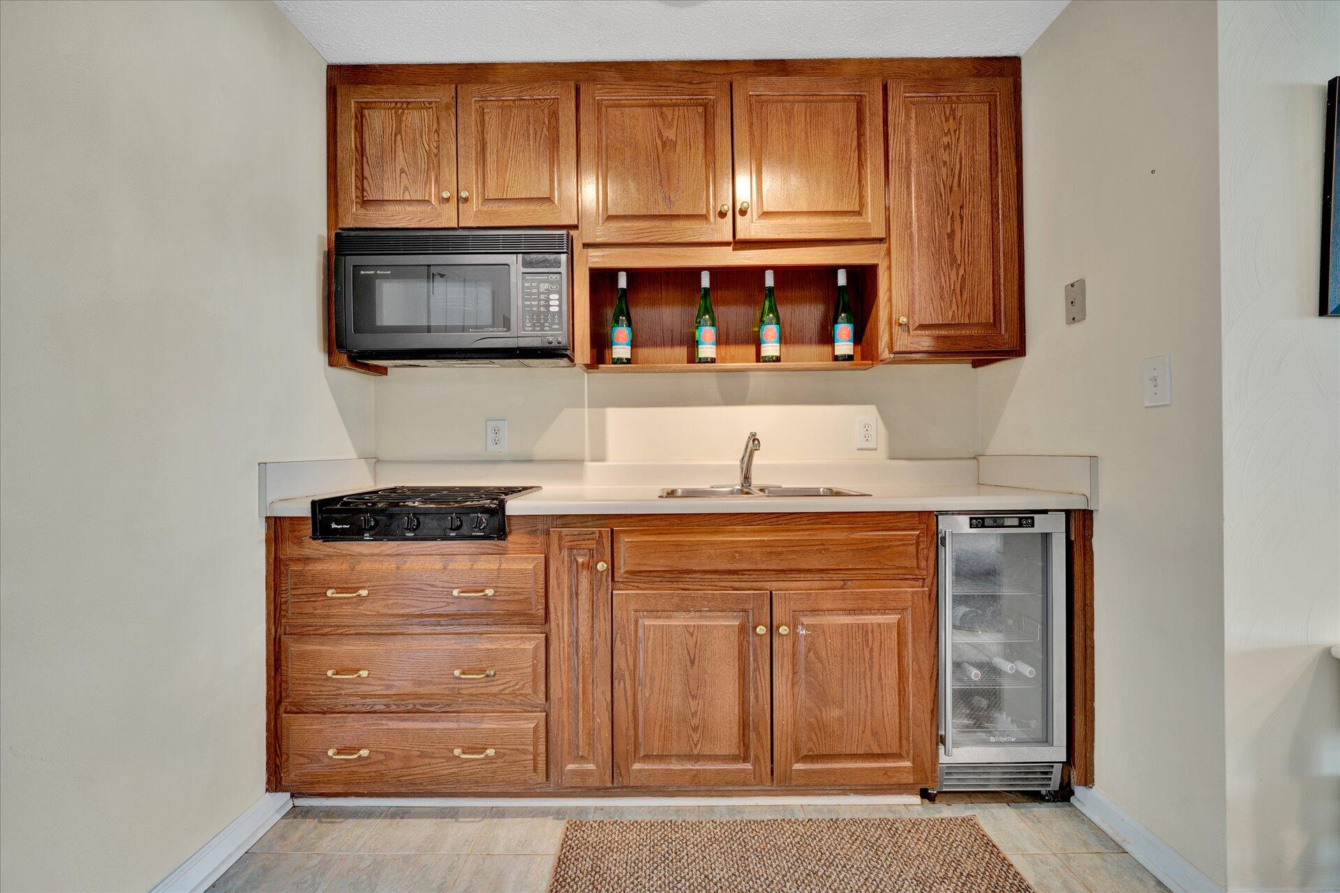 85 Chickadee Circle Moneta, VA 24121 - Photo 39 of 57 a kitchen with stainless steel appliances granite countertop a refrigerator and a stove top oven