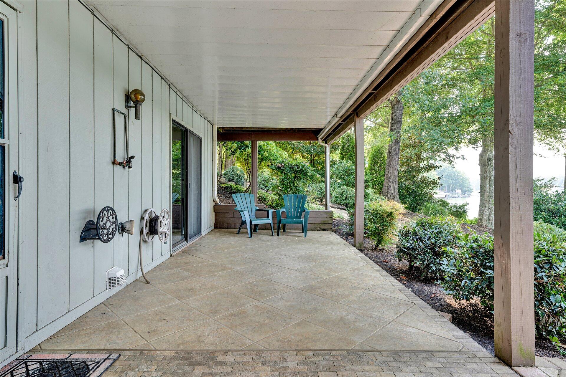 85 Chickadee Circle Moneta, VA 24121 - Photo 44 of 57 a view of a porch with chairs and backyard of the house