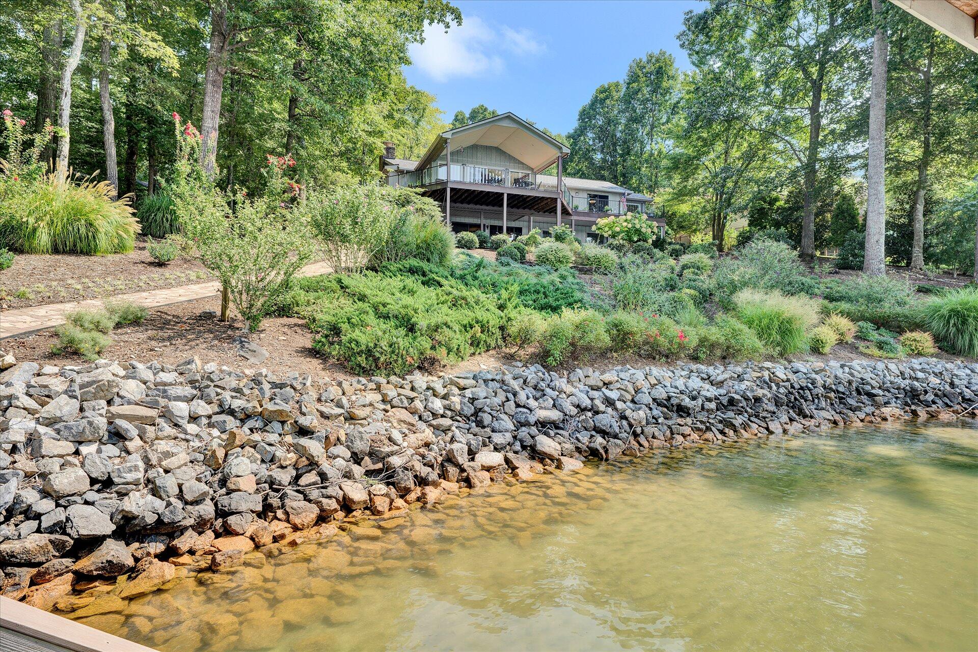 85 Chickadee Circle Moneta, VA 24121 - Photo 51 of 57 a front view of a house with a yard and fountain in middle
