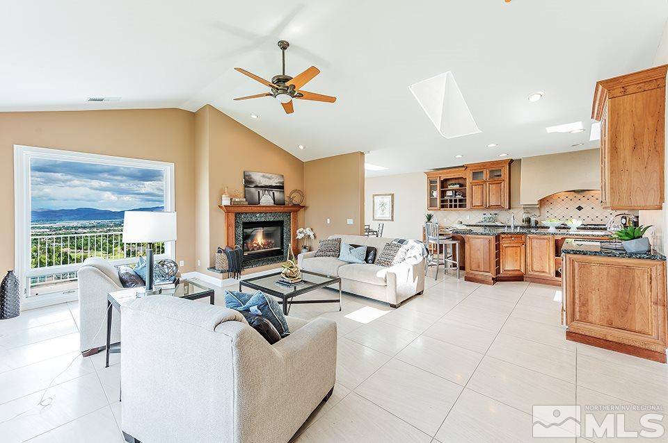 2849 Mountain Springs Road Reno, NV 89519 - Photo 5 of 25 a living room with fireplace furniture and a kitchen view