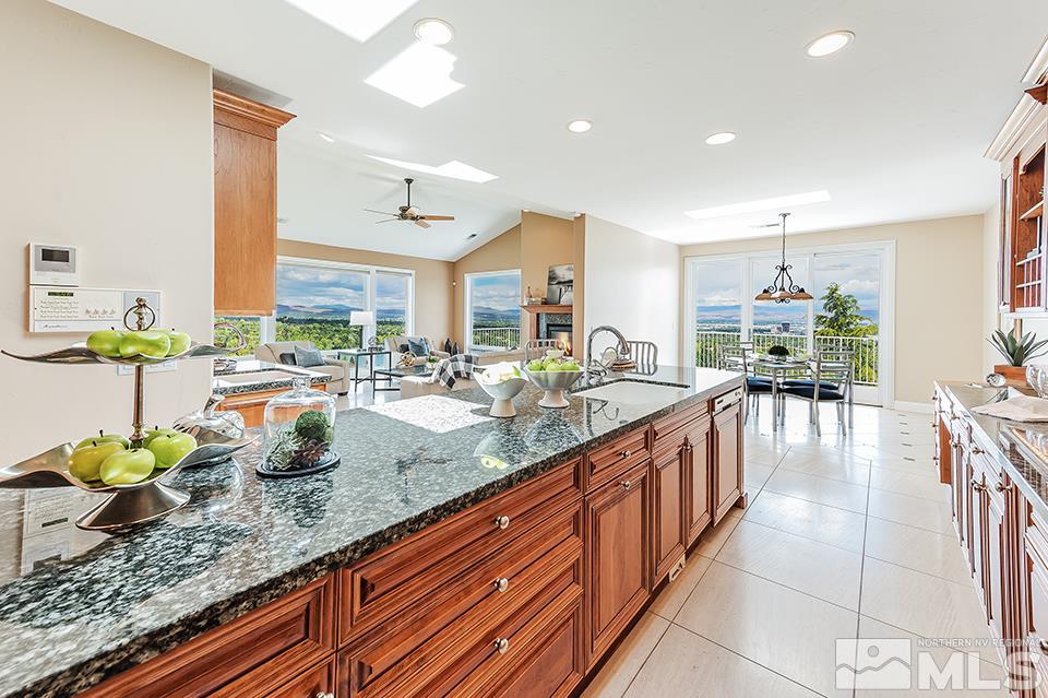 2849 Mountain Springs Road Reno, NV 89519 - Photo 6 of 25 a kitchen with lots of counter top space and living room view